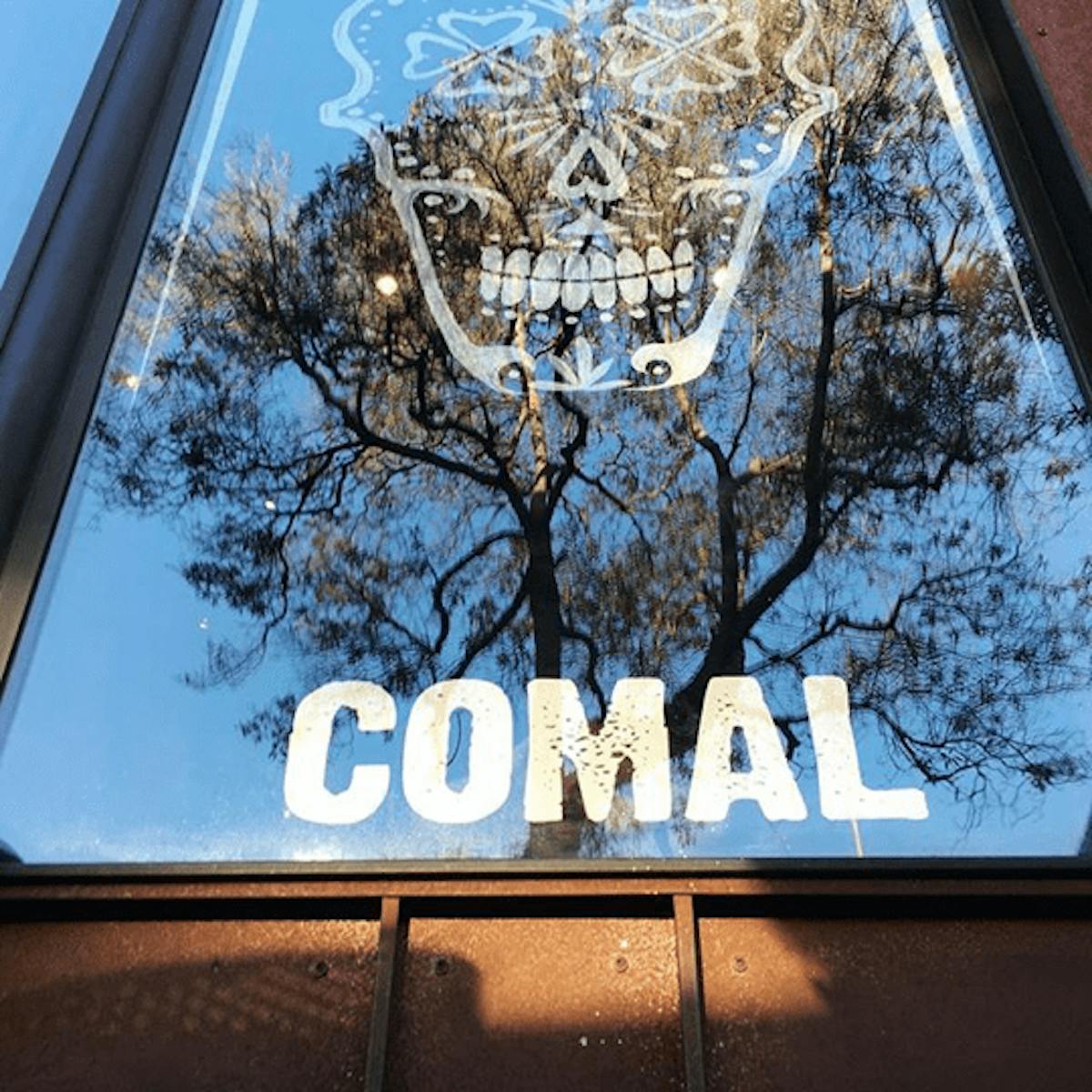 a close up of a sign in front of a window