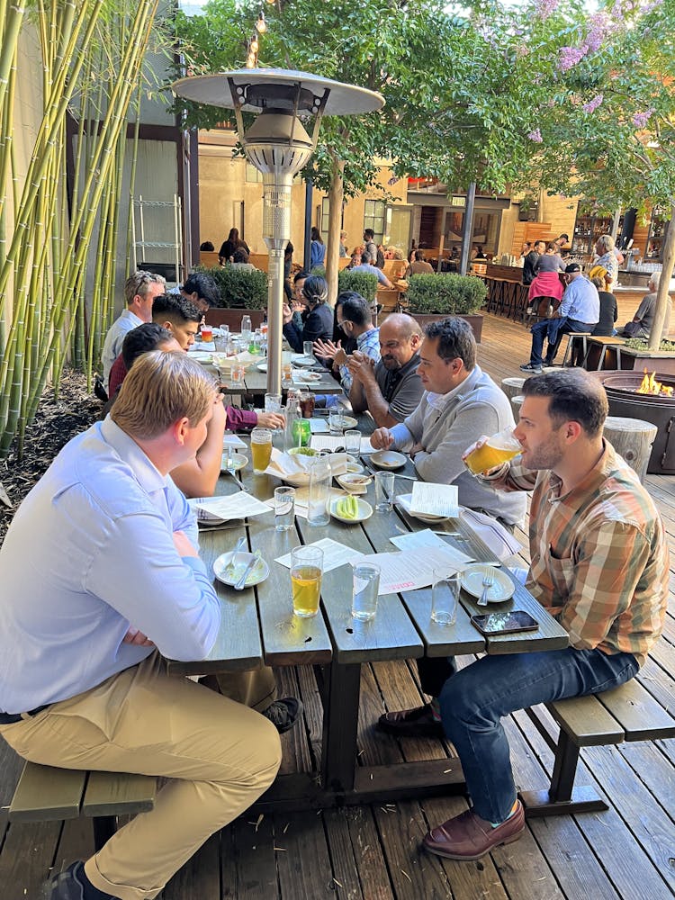 a group of people sitting at a table