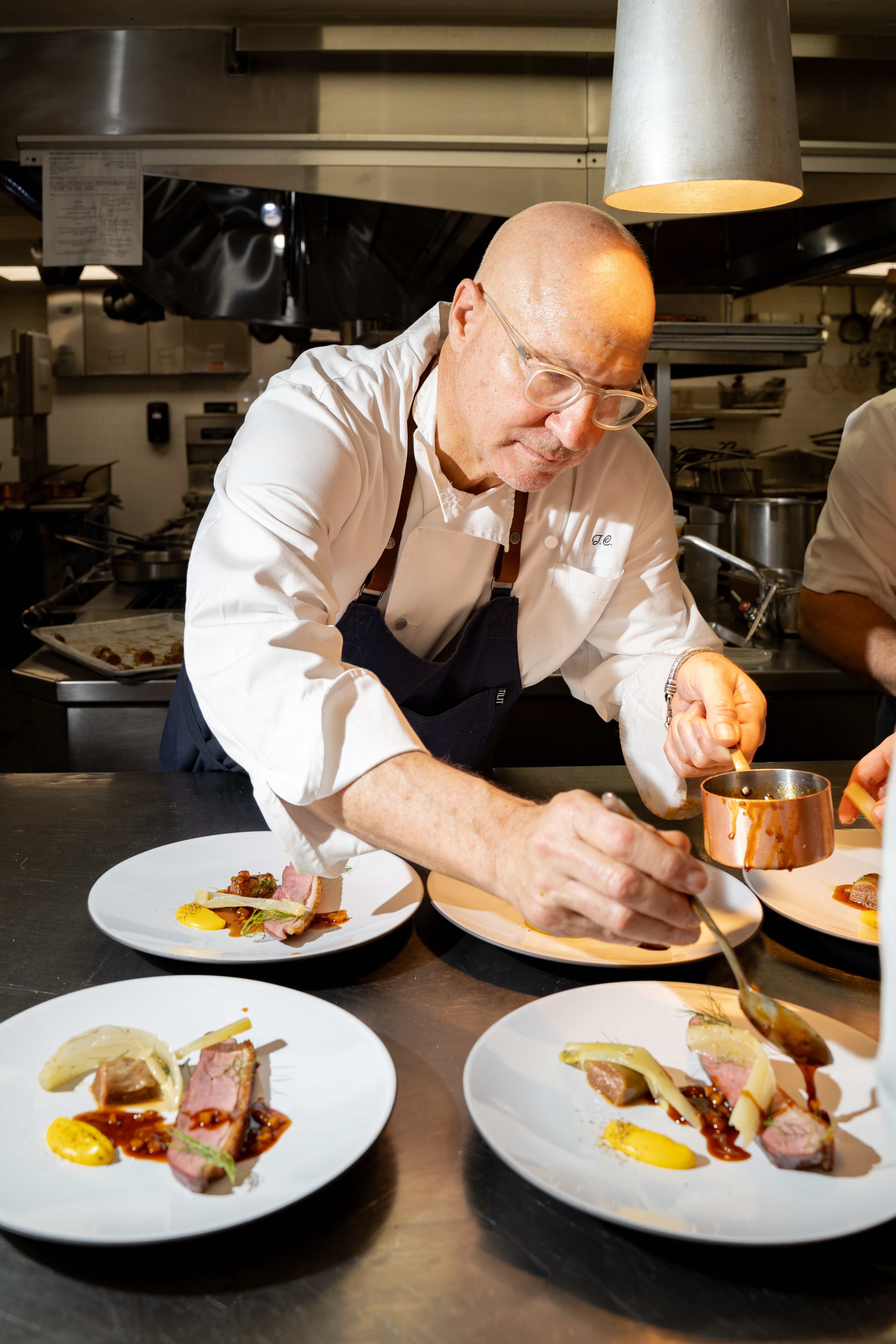 a man preparing food in a kitchen