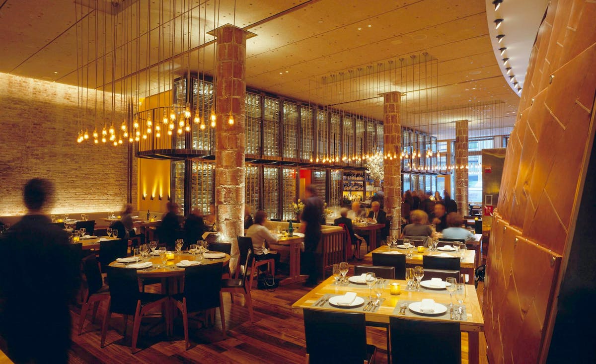 a group of people sitting at a table in a restaurant