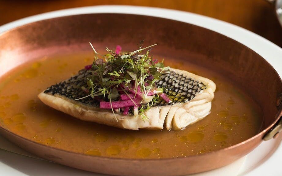 a piece of fish cooking