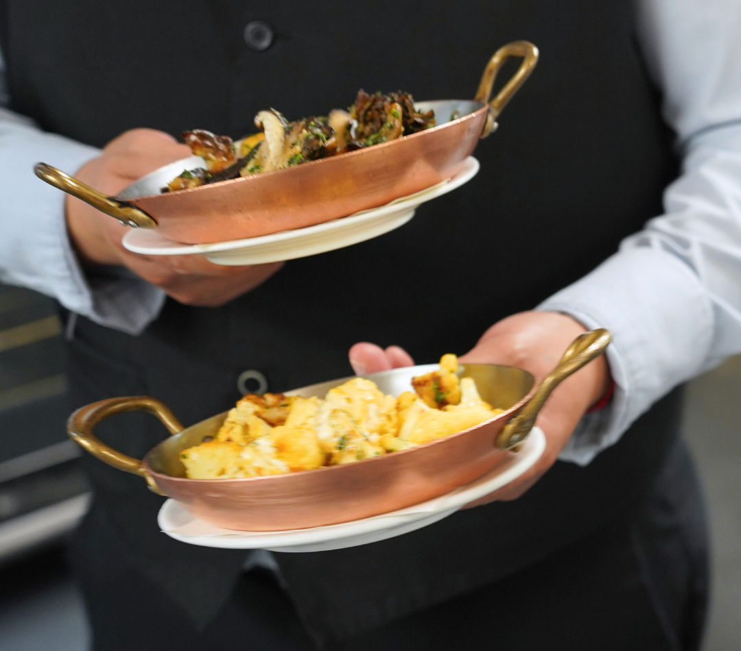 a person holding a plate of food