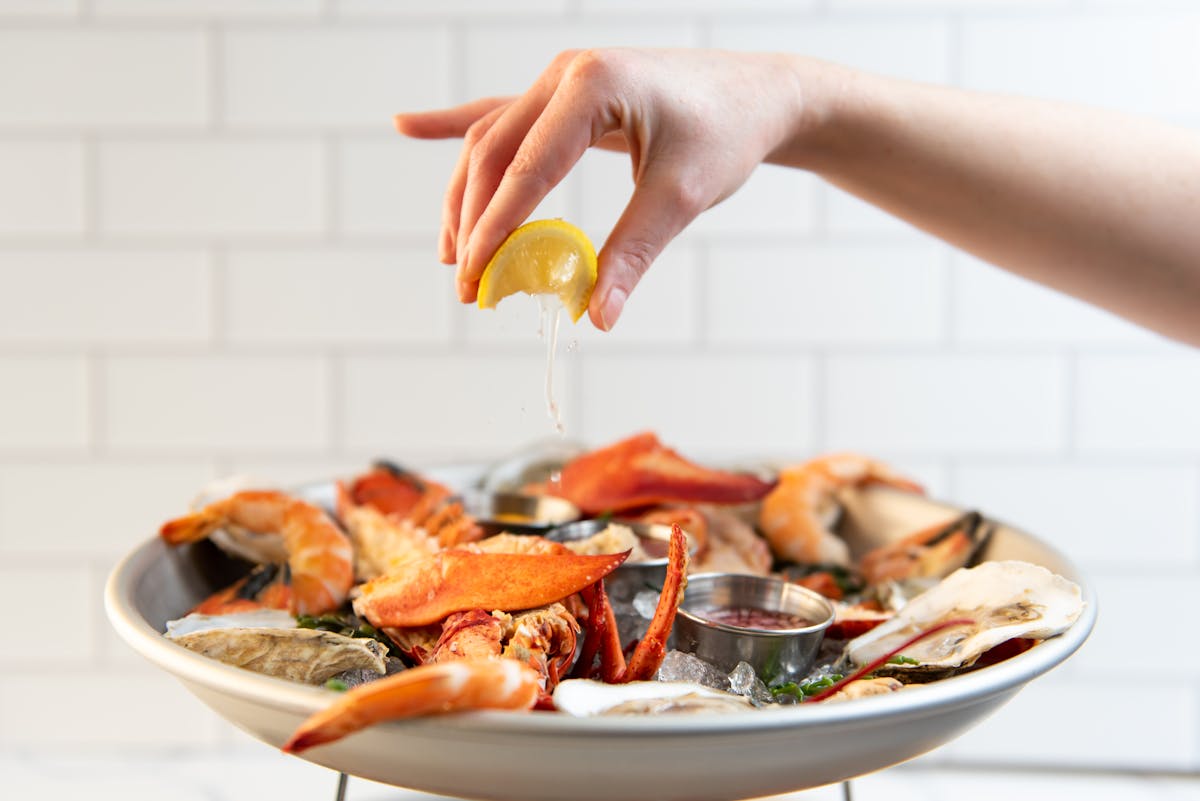a person holding a plate of food