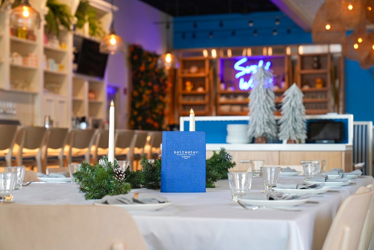 a person sitting at a table in a restaurant