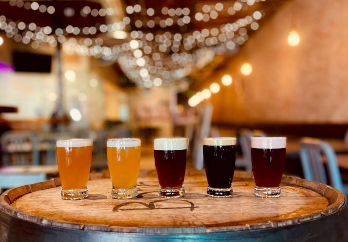 a close up of a glass of beer on a table