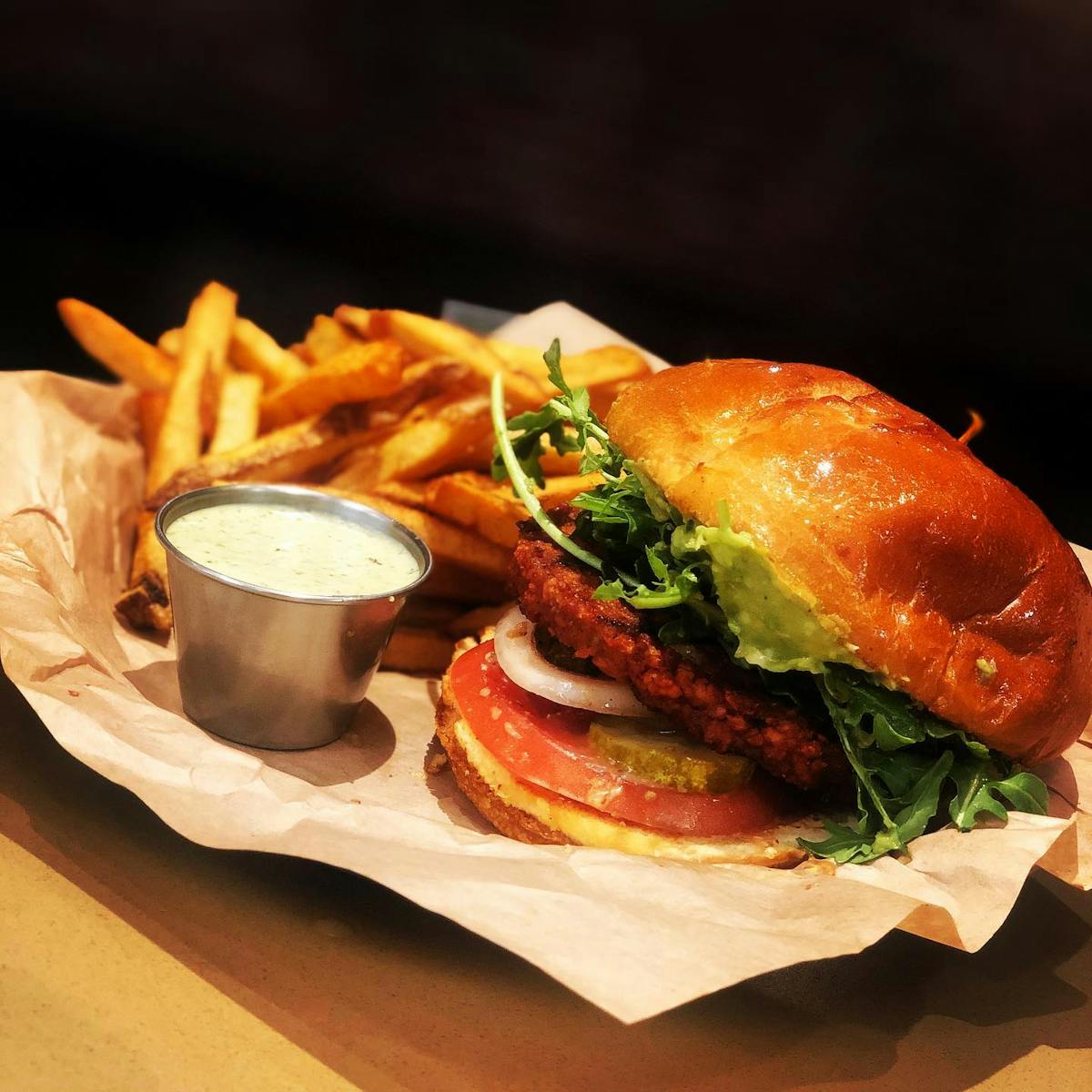 a close up of a sandwich sitting on top of a wooden table