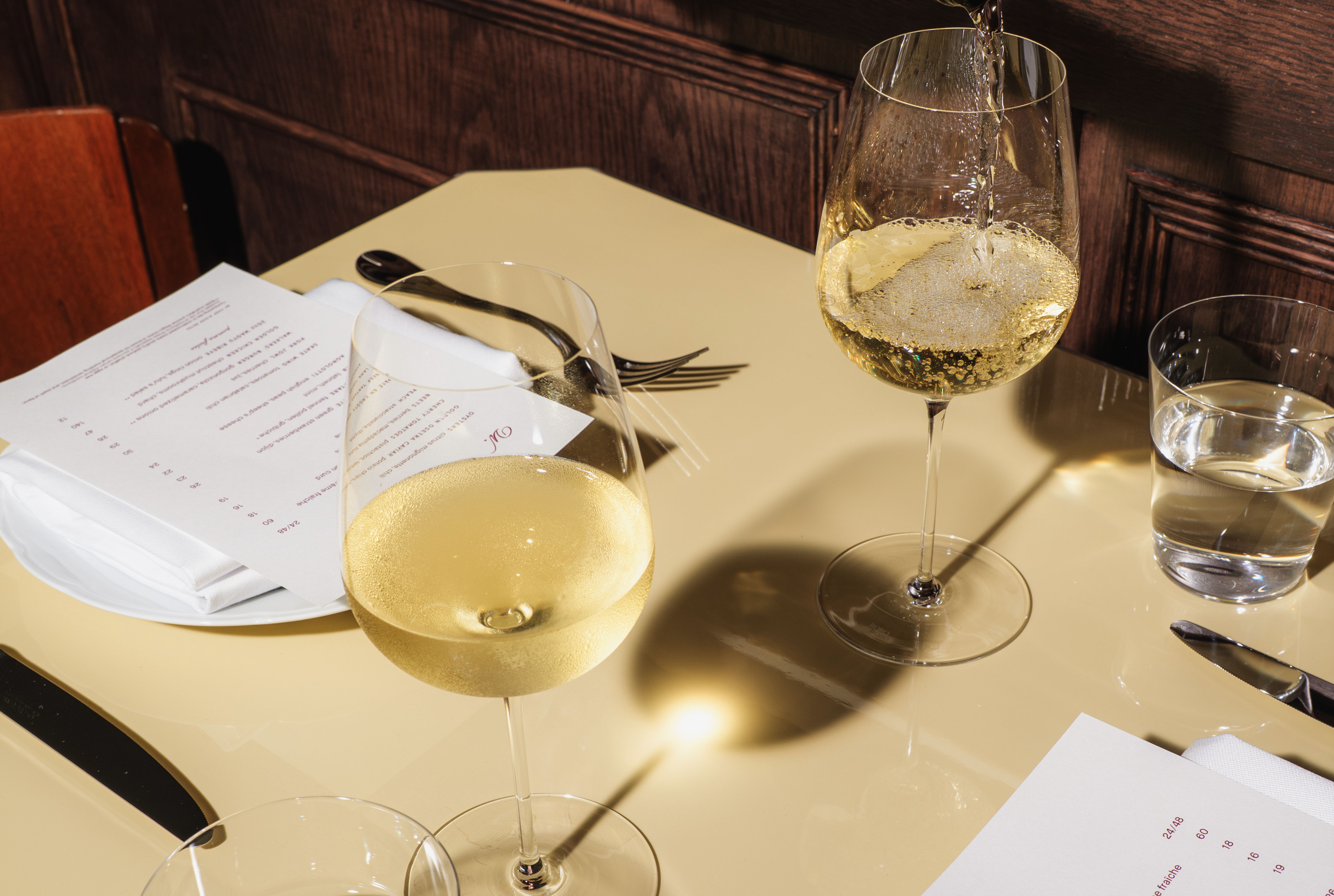 a glass of wine on a table