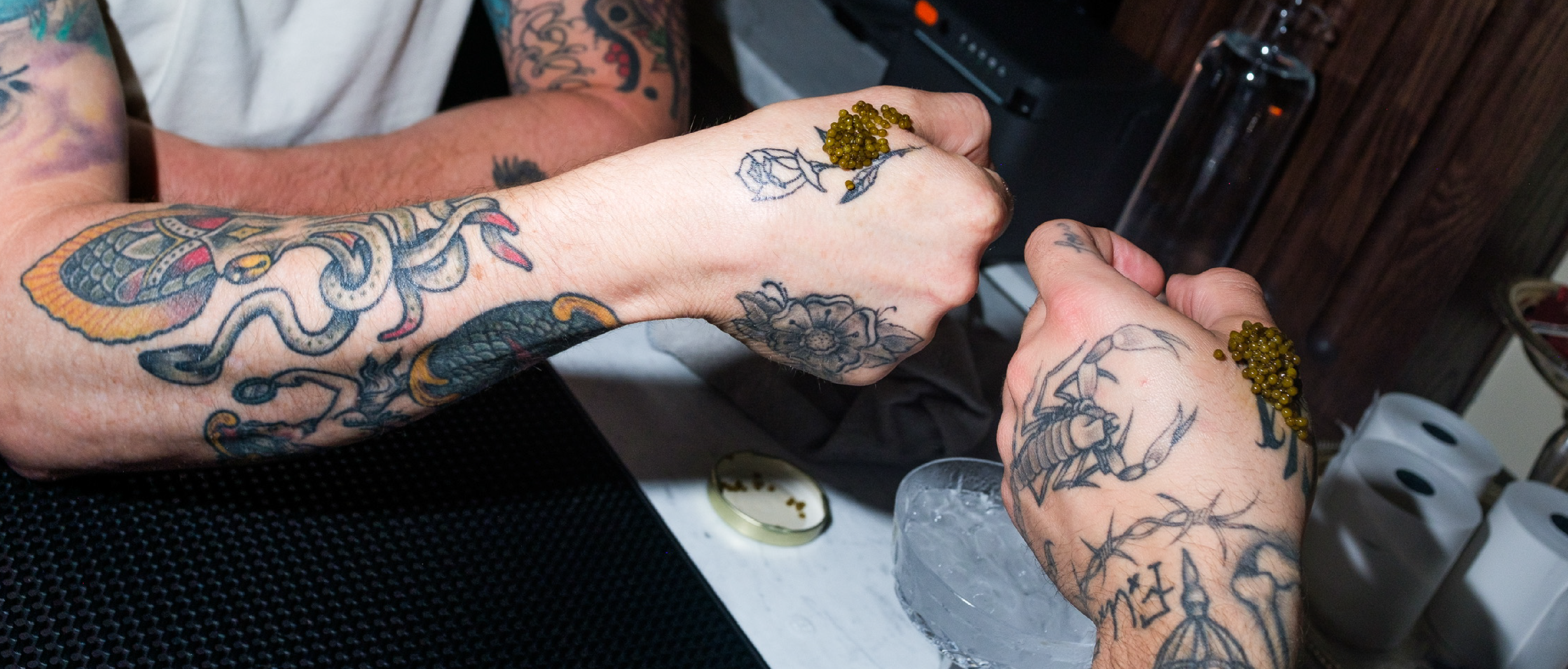 a person's hands with tattoos on their hands