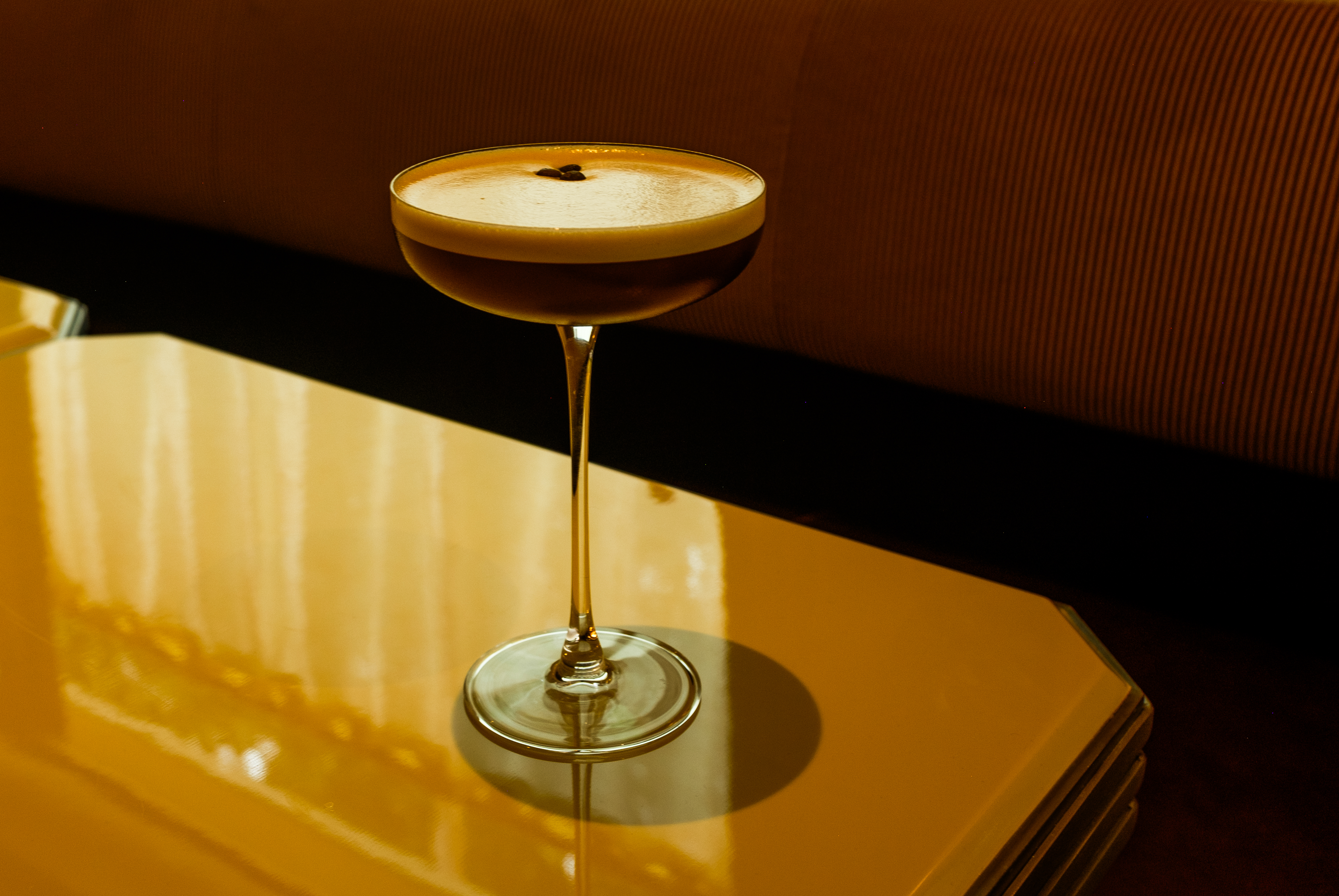 a glass with a brown liquid in it