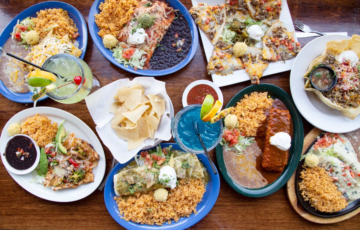 Several plates of food on a table