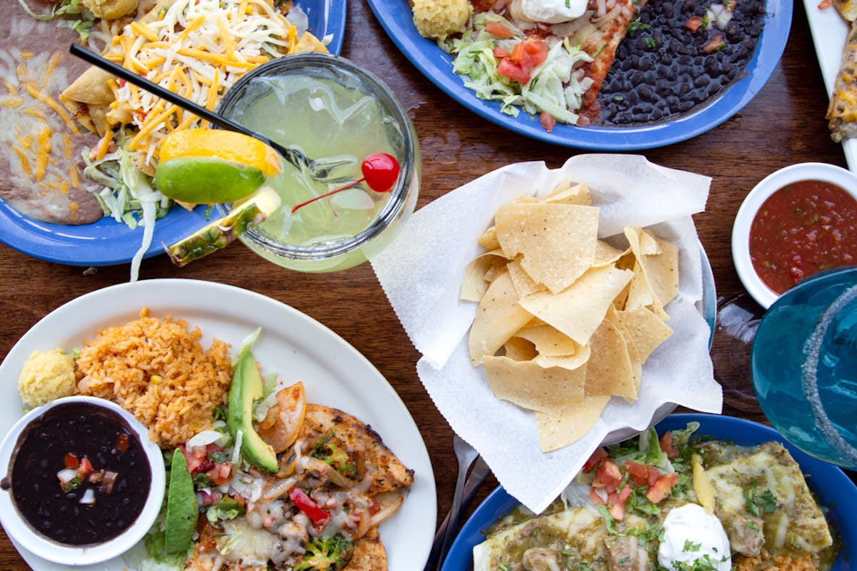 a bowl filled with different types of food on a table