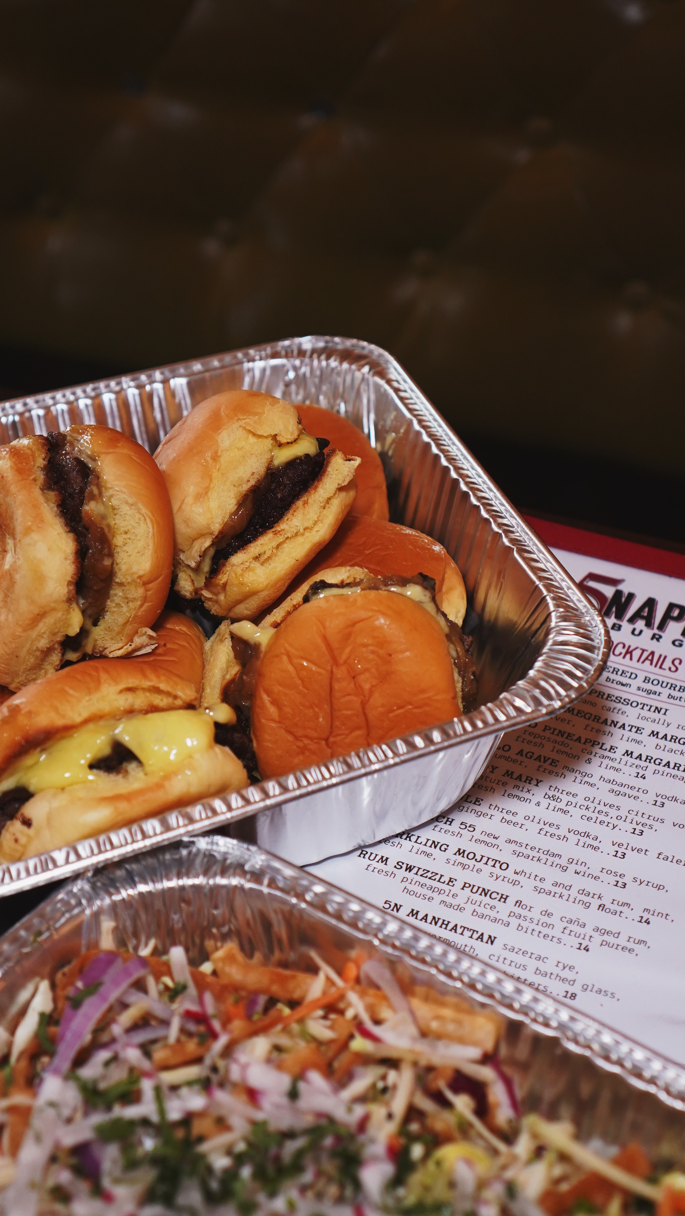 a close up of sliders on a tray