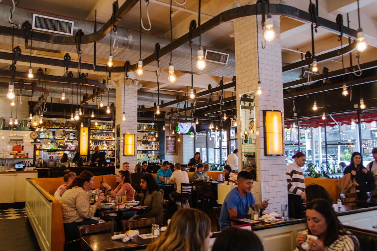 a dining area full of people