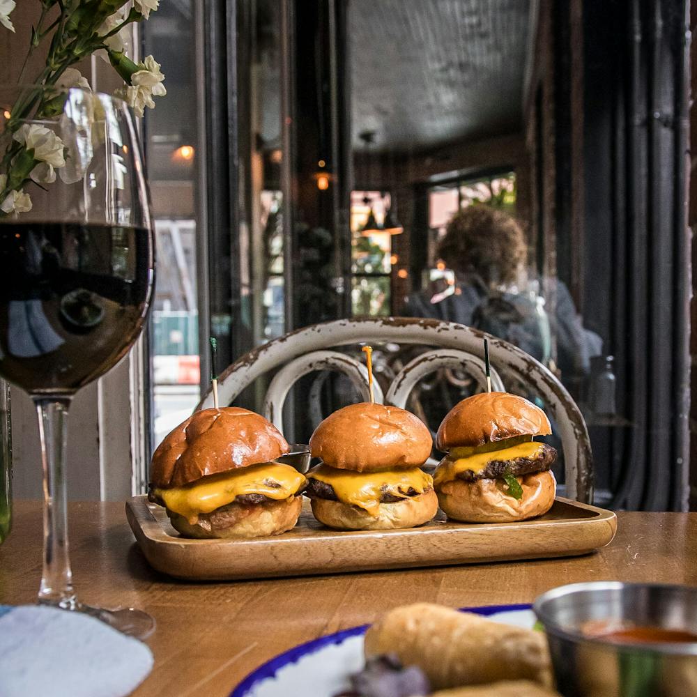 a plate of food and a glass of wine