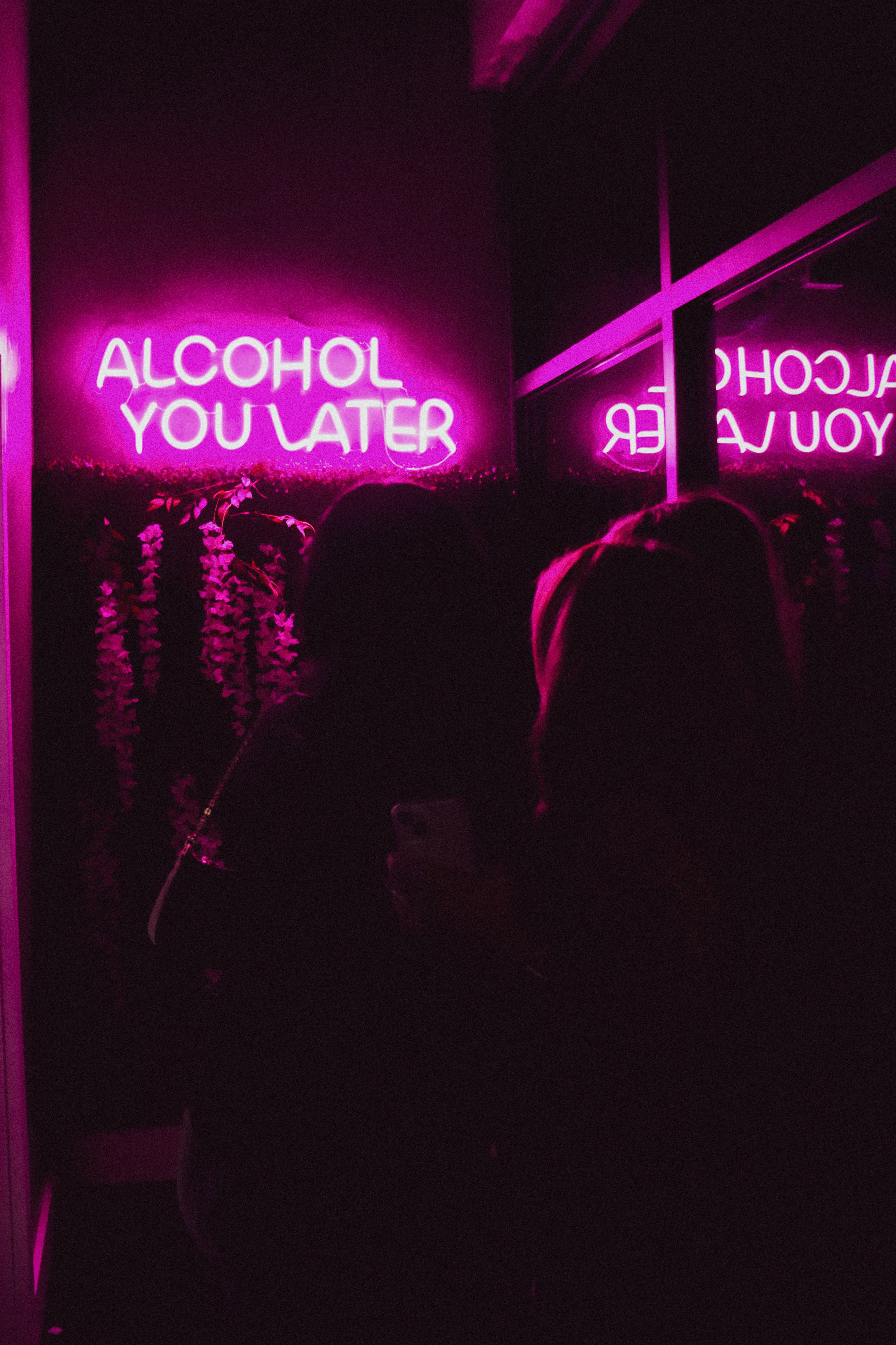 a sign lit up at night