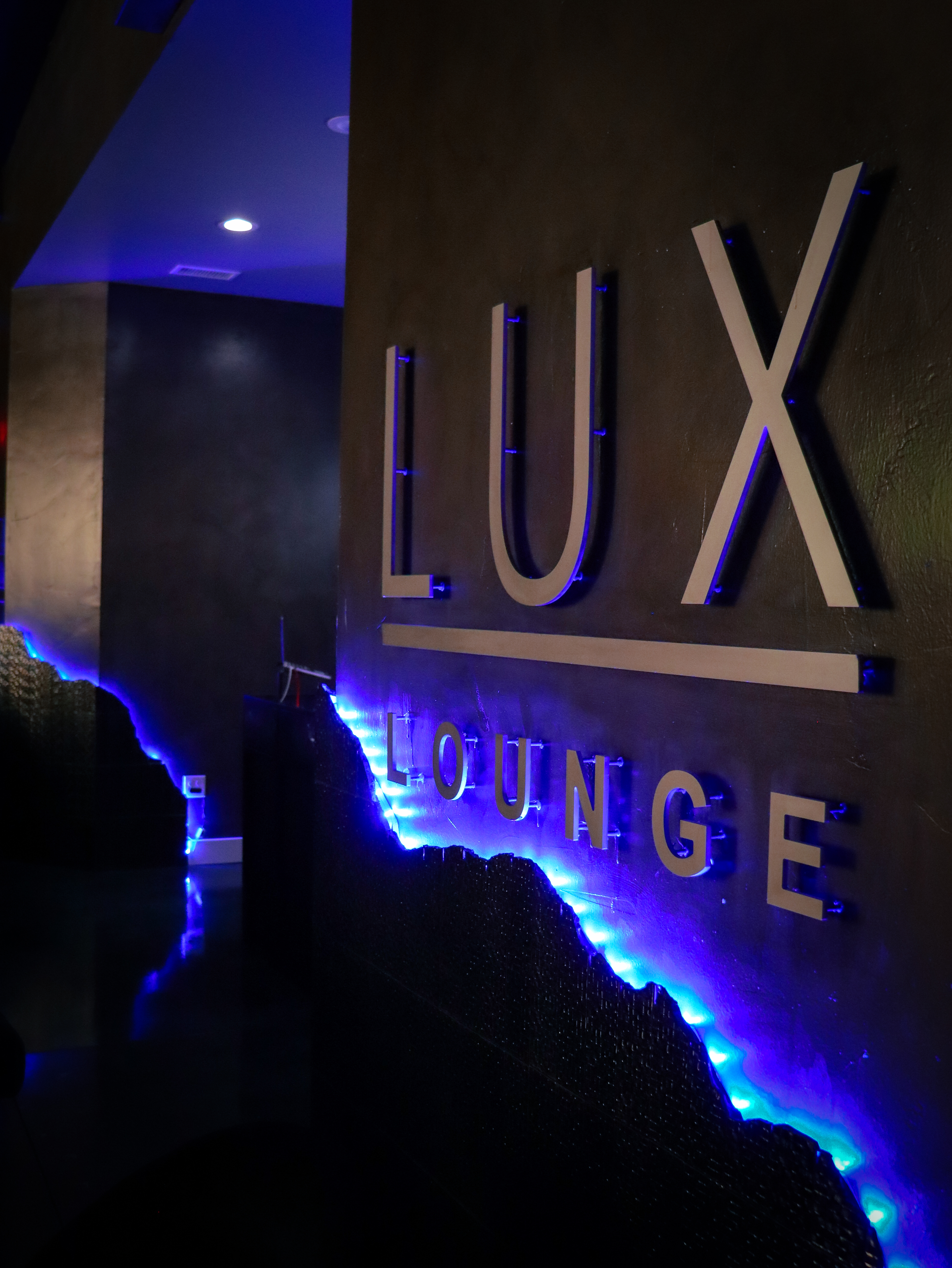 a purple light in a dark room