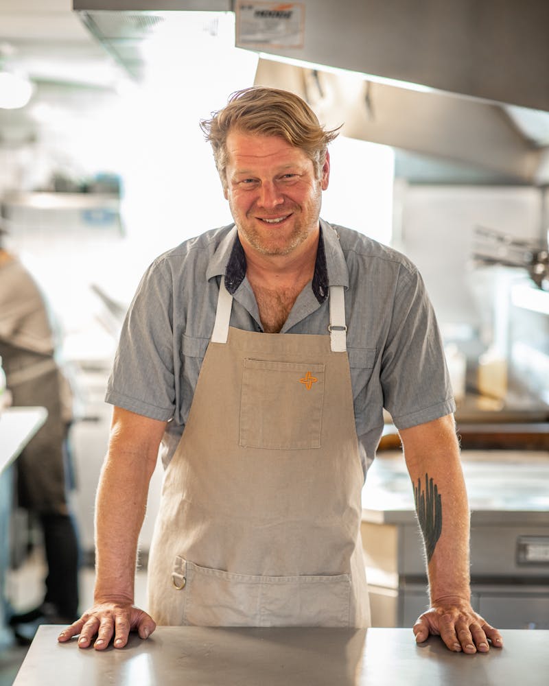 a man standing in a kitchen