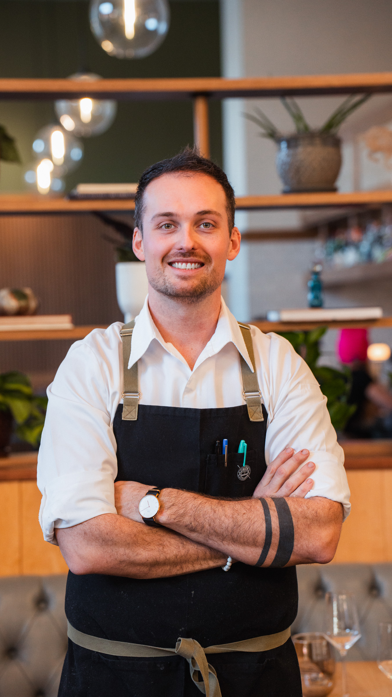 A man standing  in front of a camera