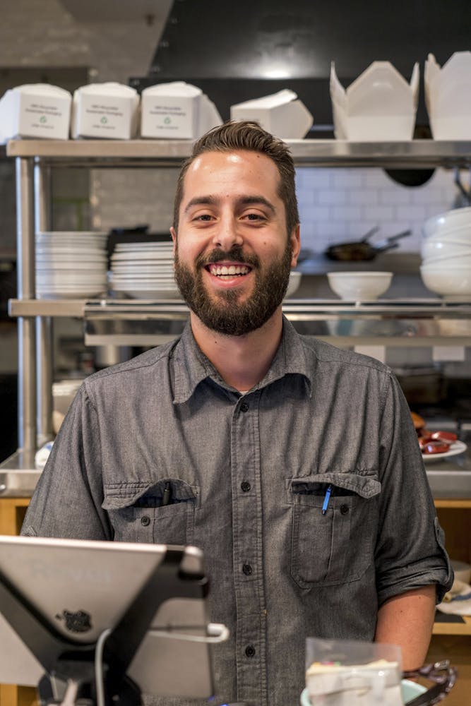 a man standing in front of a counter
