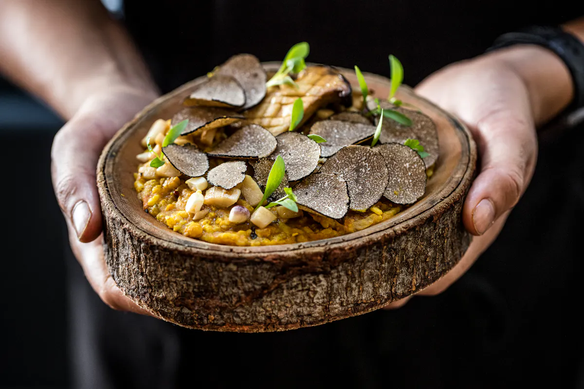 a person holding a bowl of food
