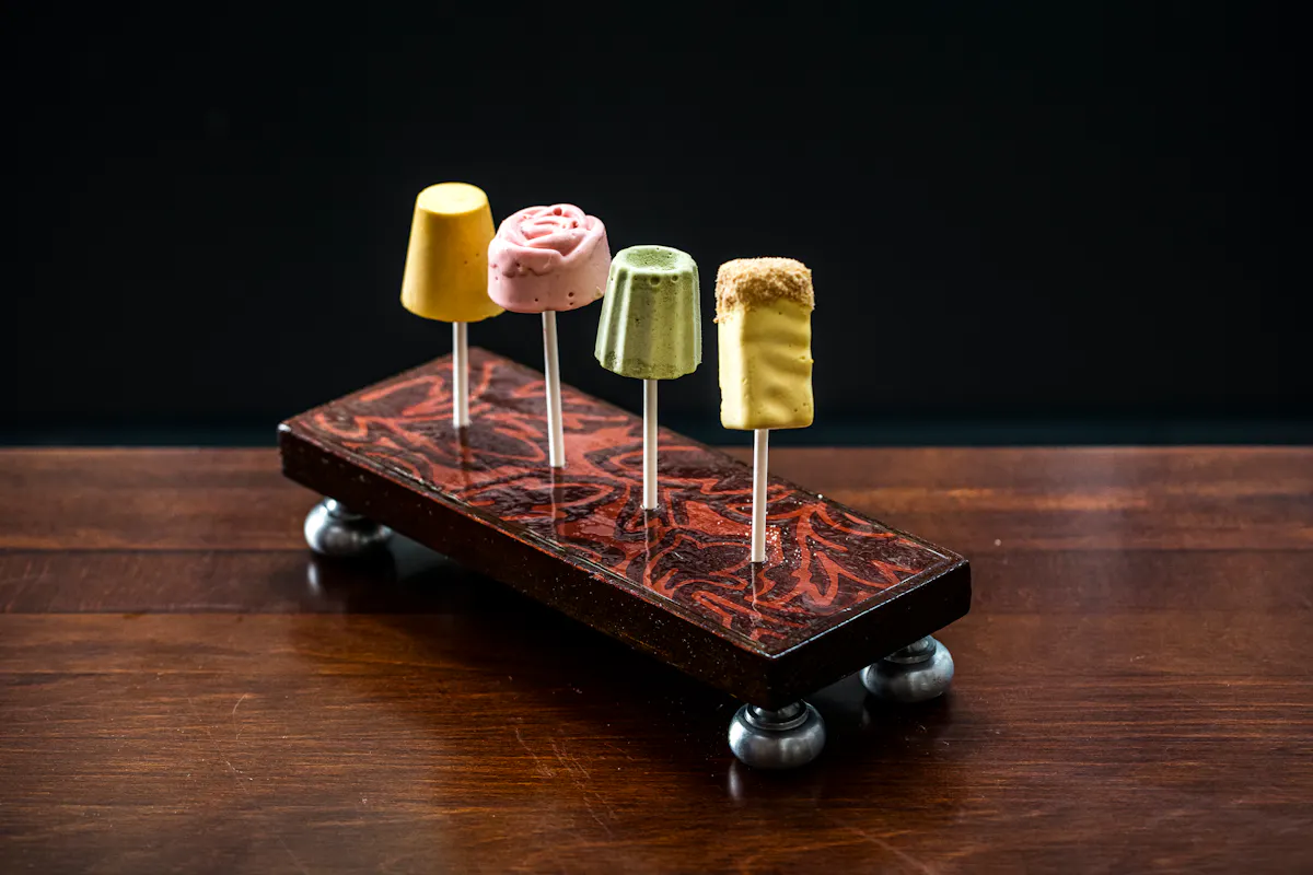 a cake sitting on top of a wooden table