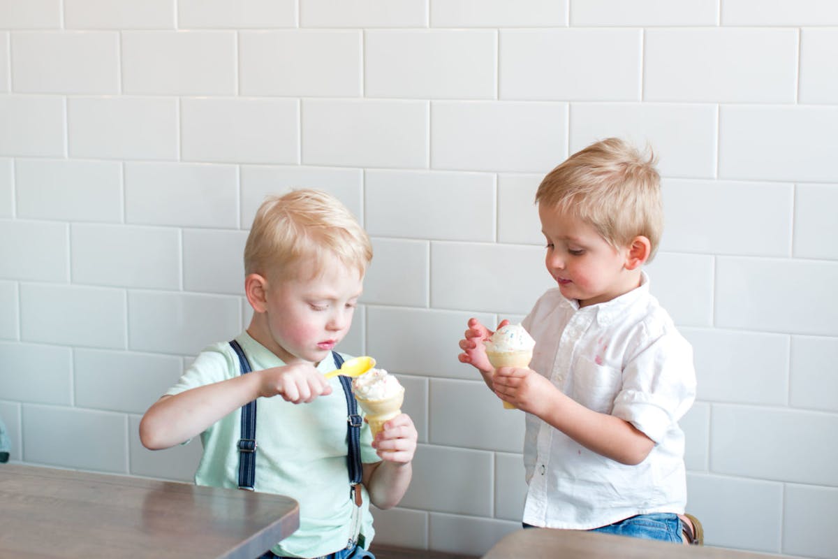 a young boy brushing his teeth