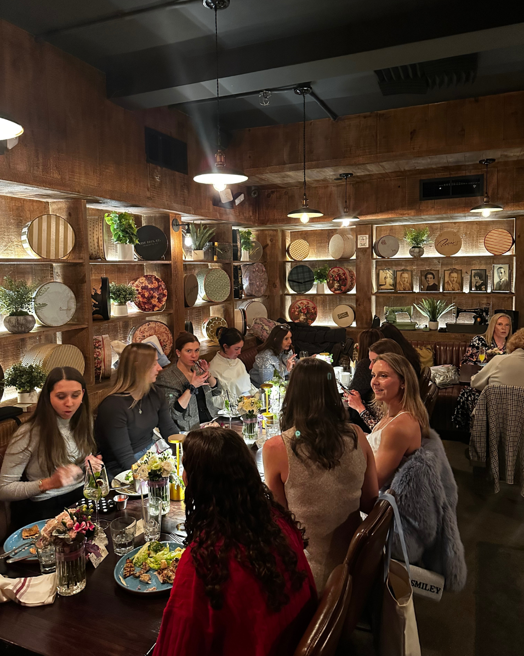 brunch table of people sitting and food