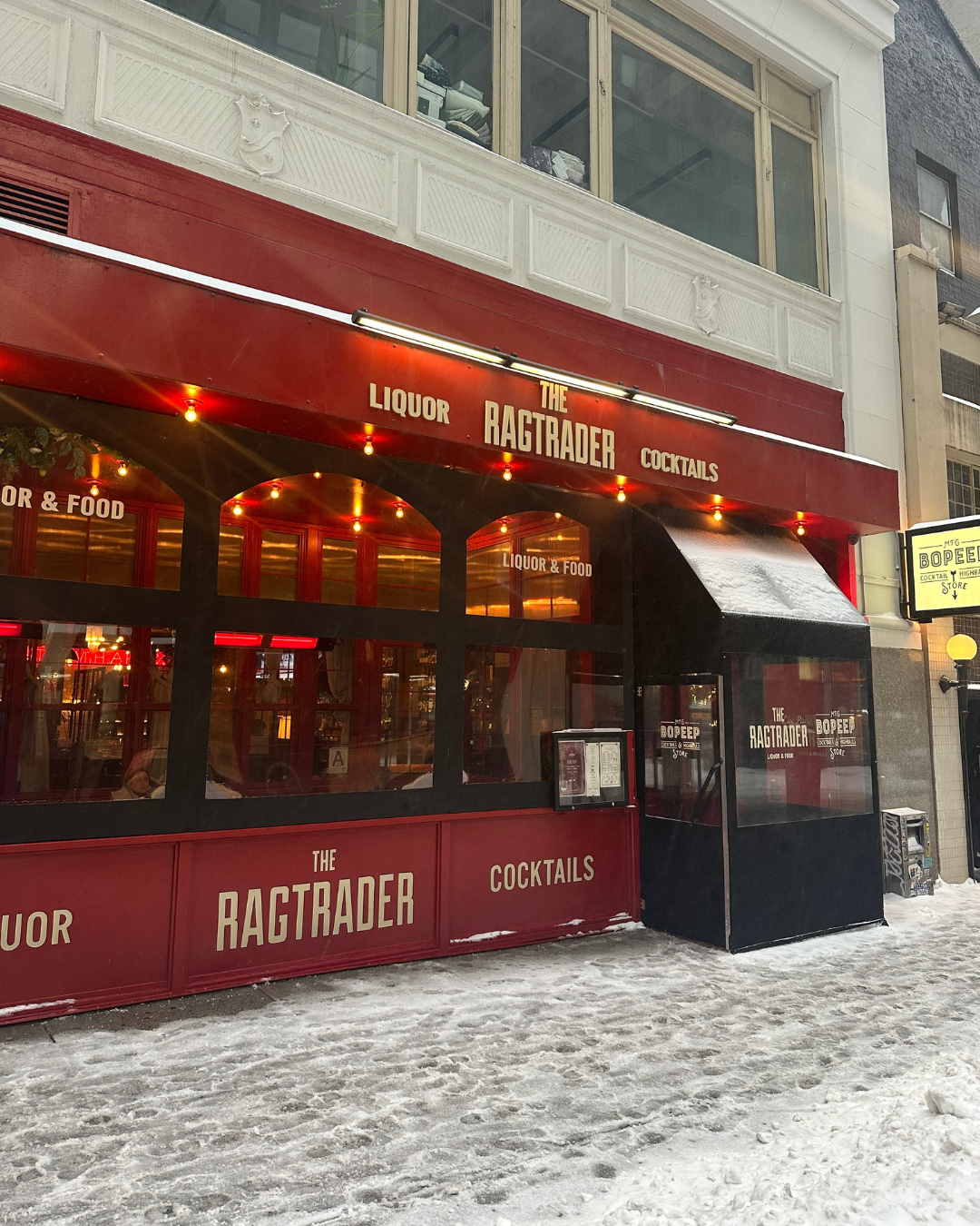 a double decker bus parked in front of a building