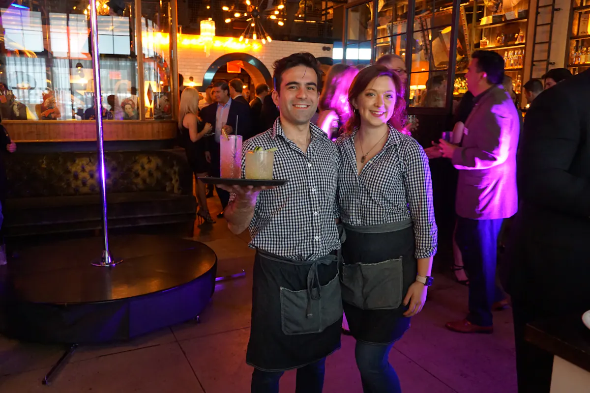 a person holding drinks