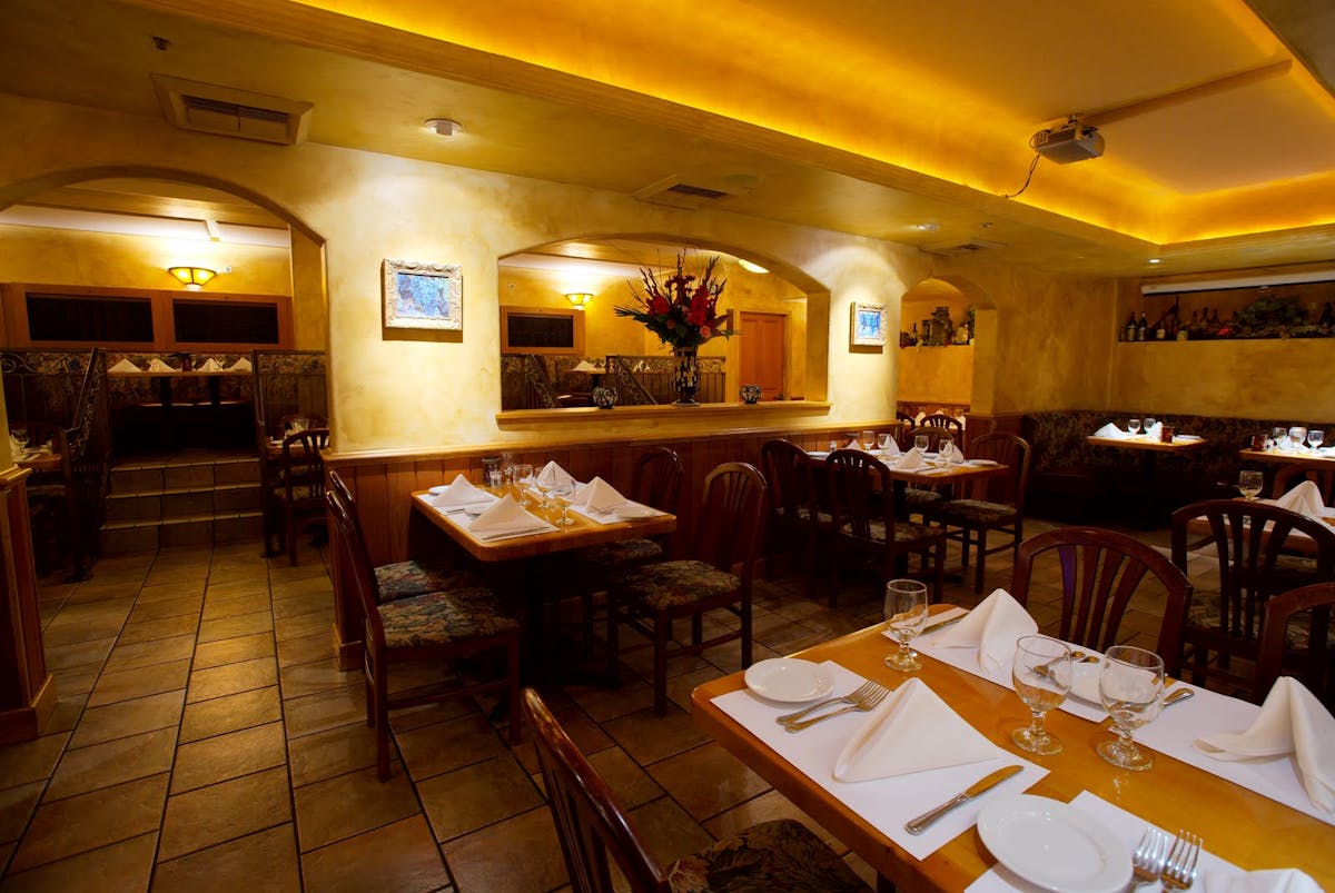 a room filled with furniture and a table in a restaurant