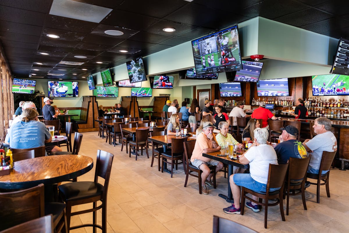 people seating on the restaurants table 