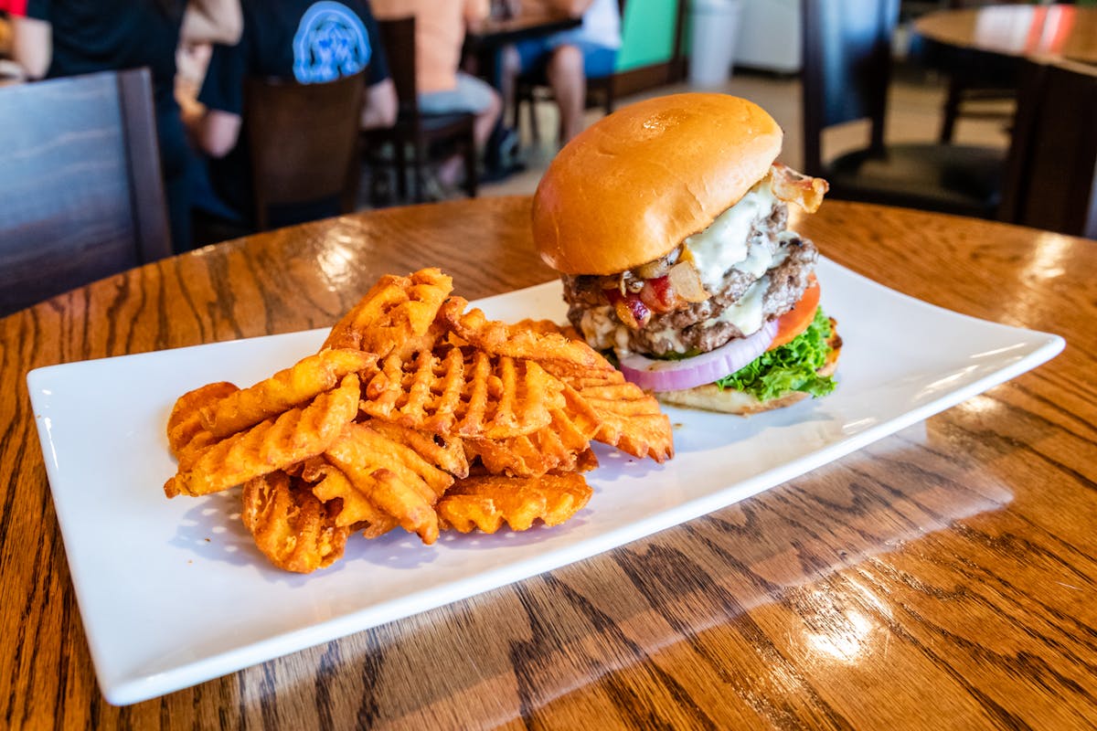 a burger with waffle fries 