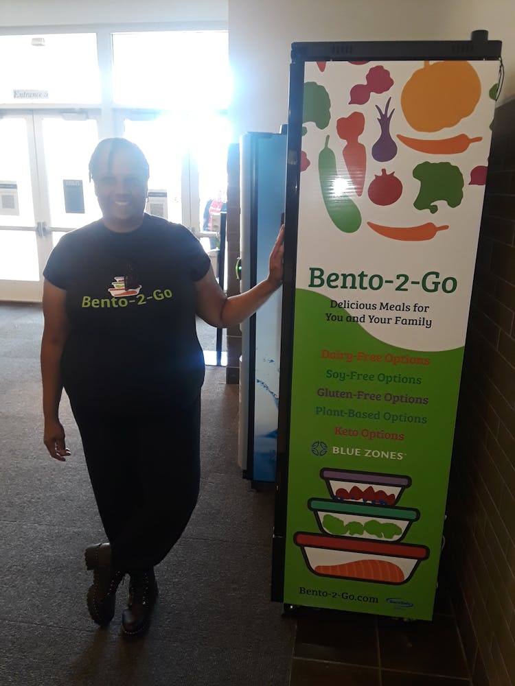 a person standing in front of a refrigerator