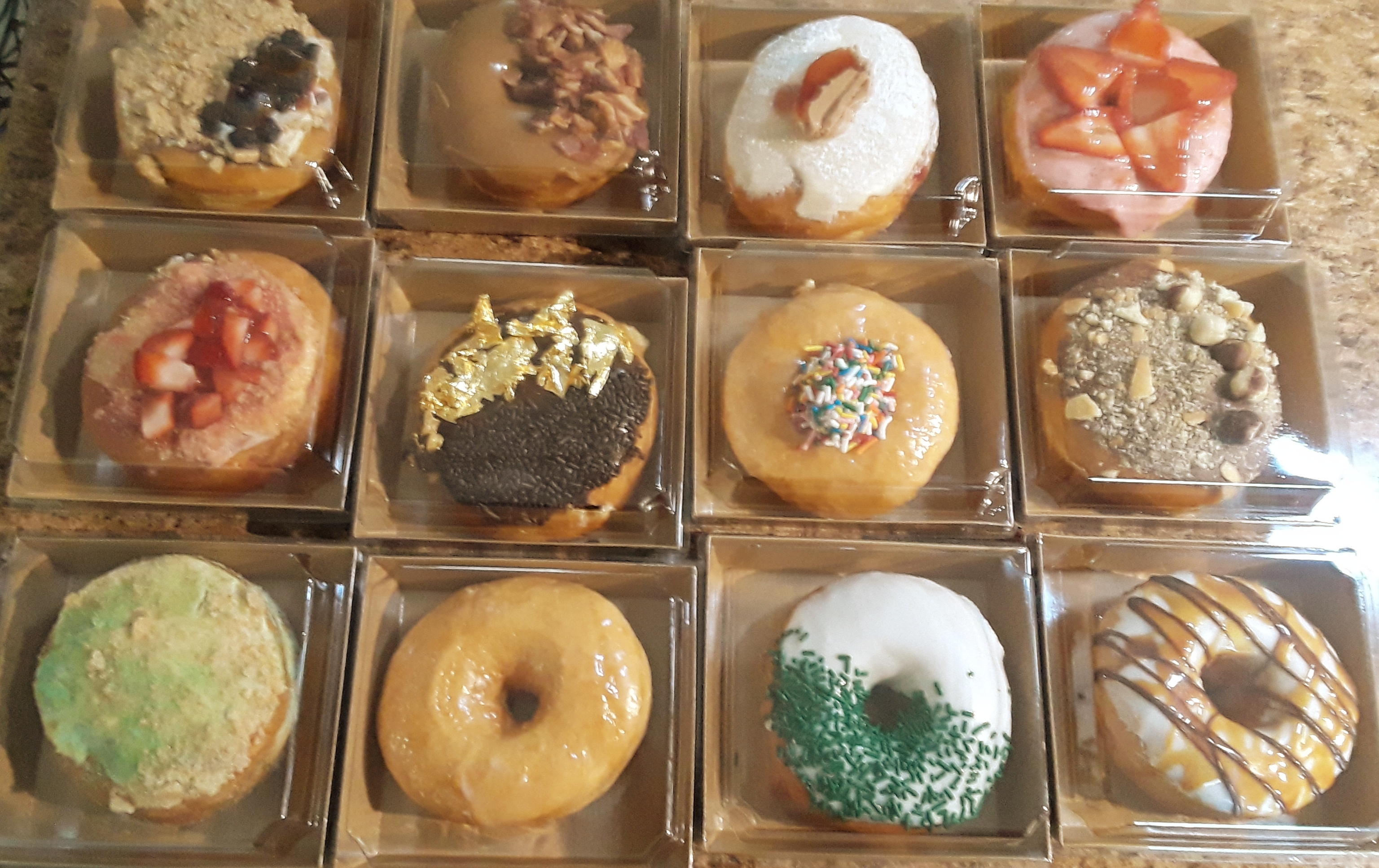 a bunch of different kinds of donuts