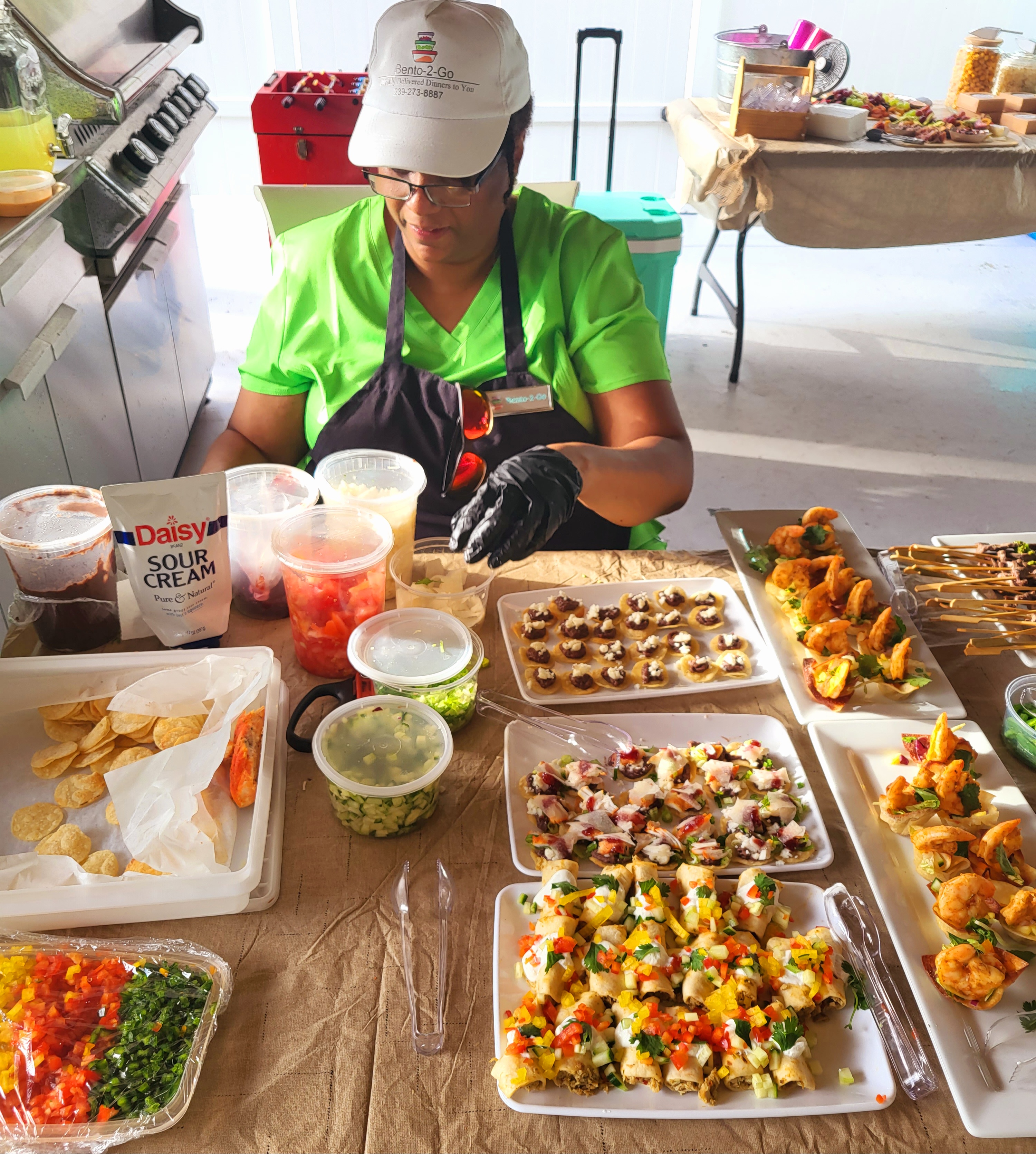 a woman sitting at a table with food