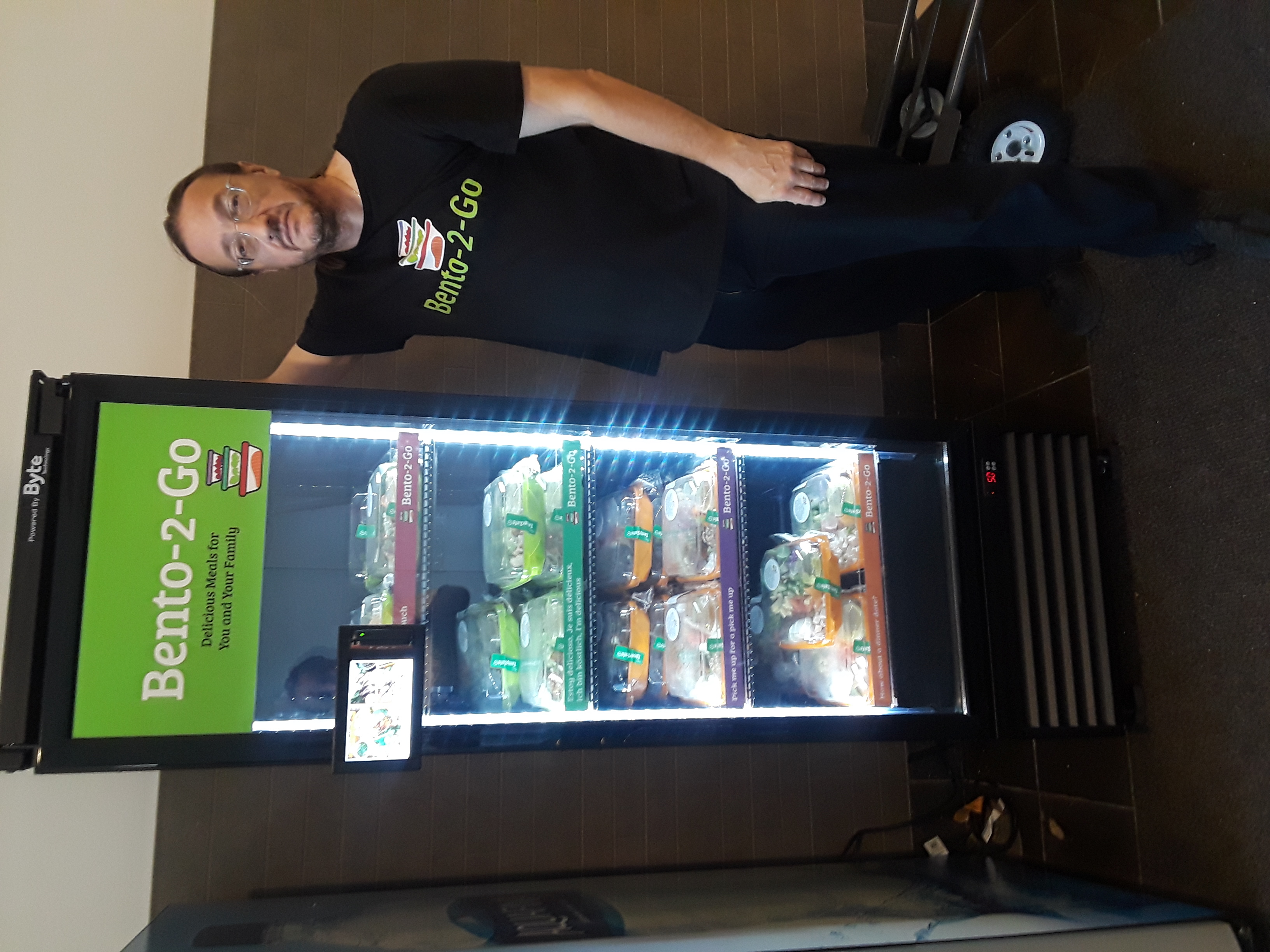 a man standing in front of a refrigerator