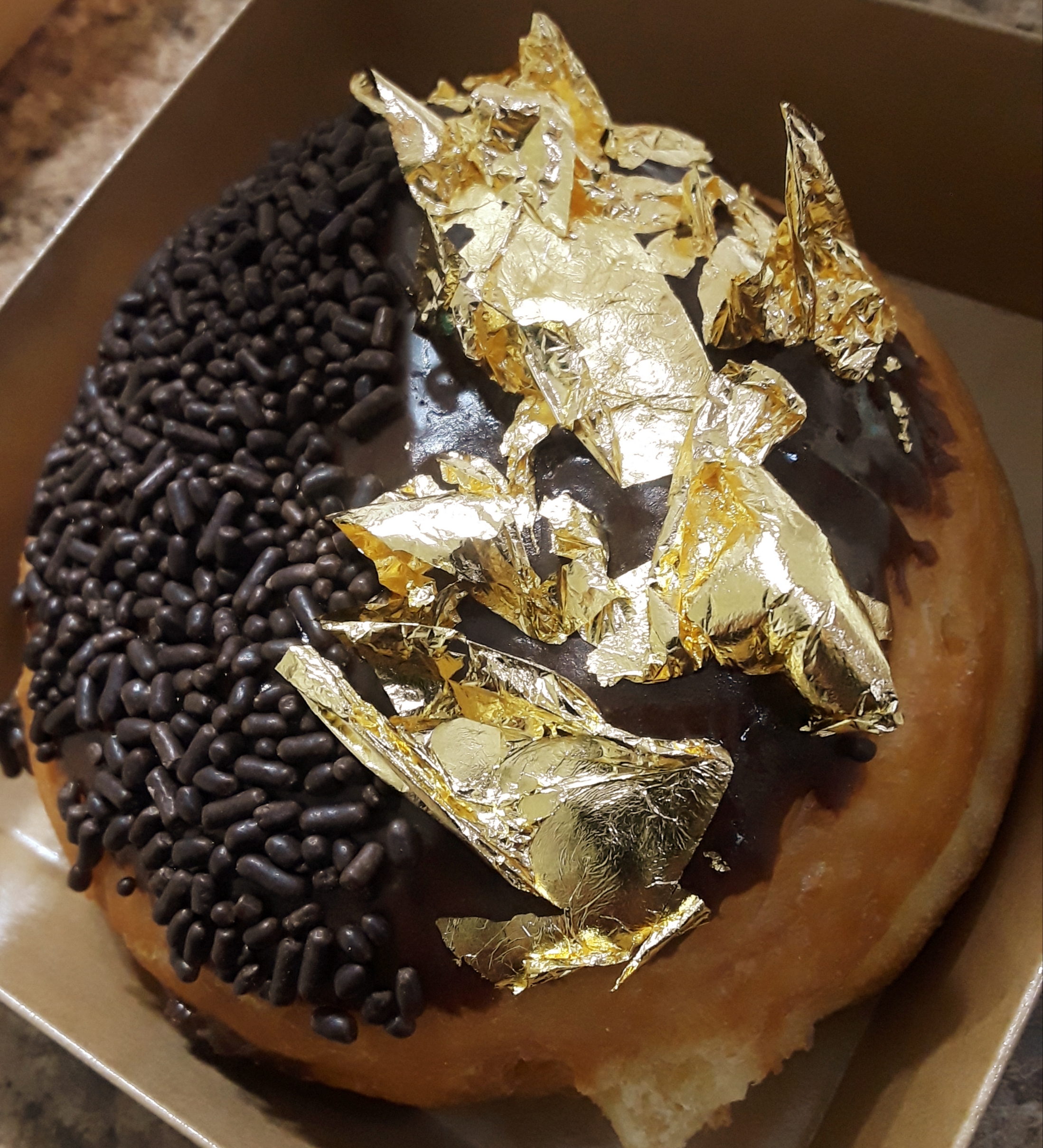 a 24-KT Boston Cream Donut