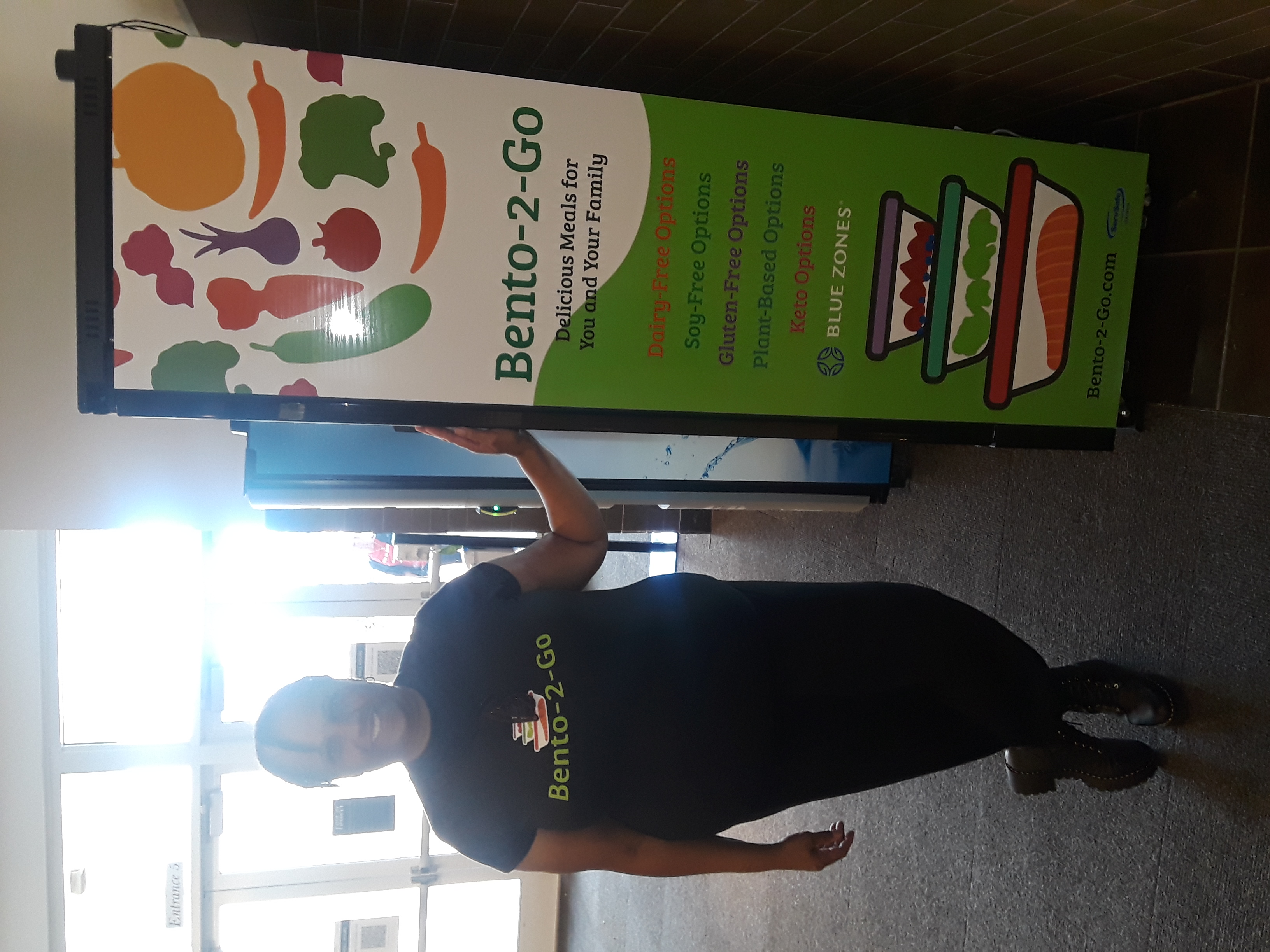 a person standing in front of a refrigerator