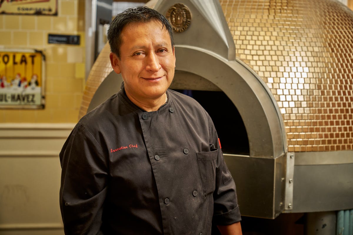 a chef wearing a black uniform t-shirt