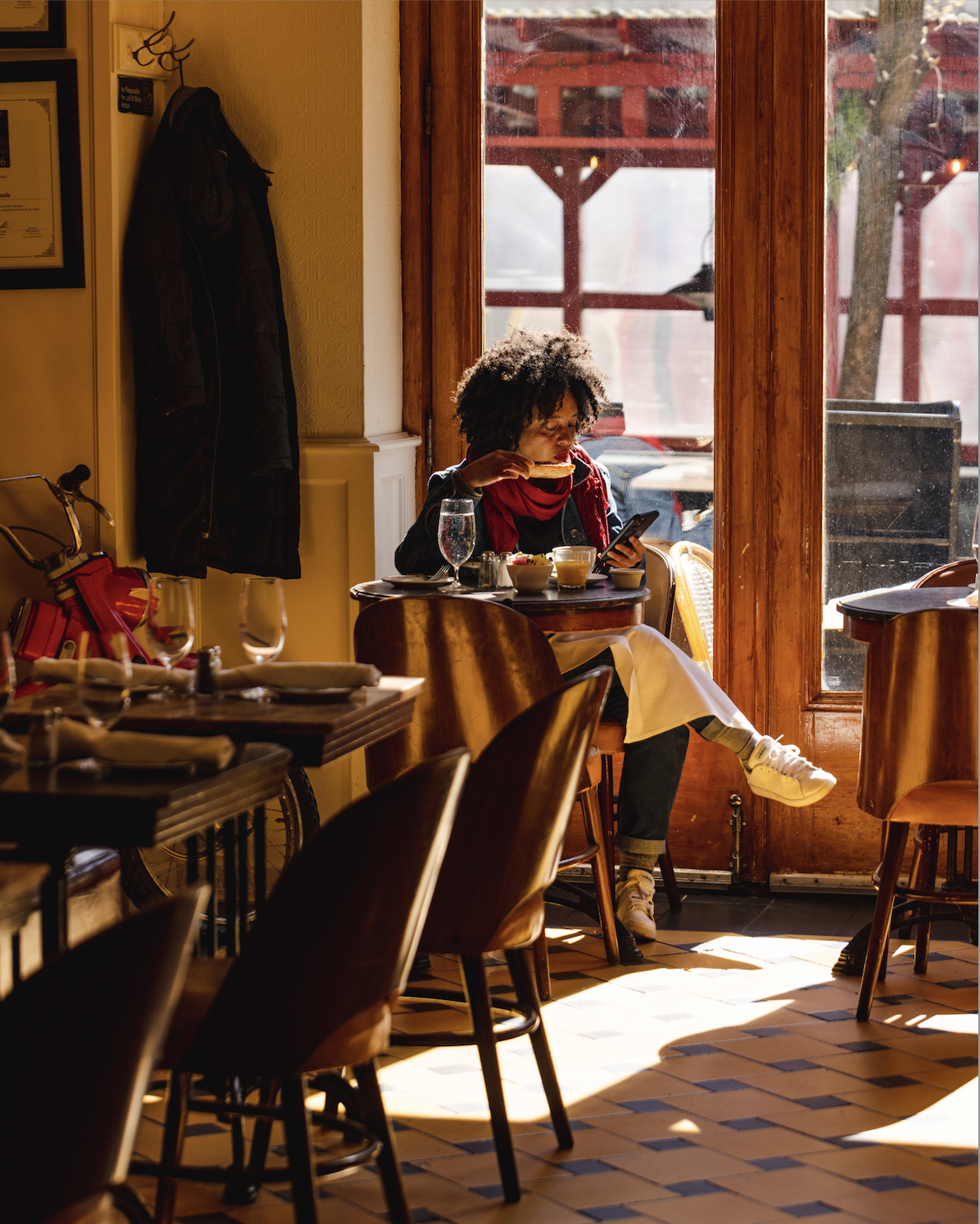 a woman drinking a coffee cup and bread