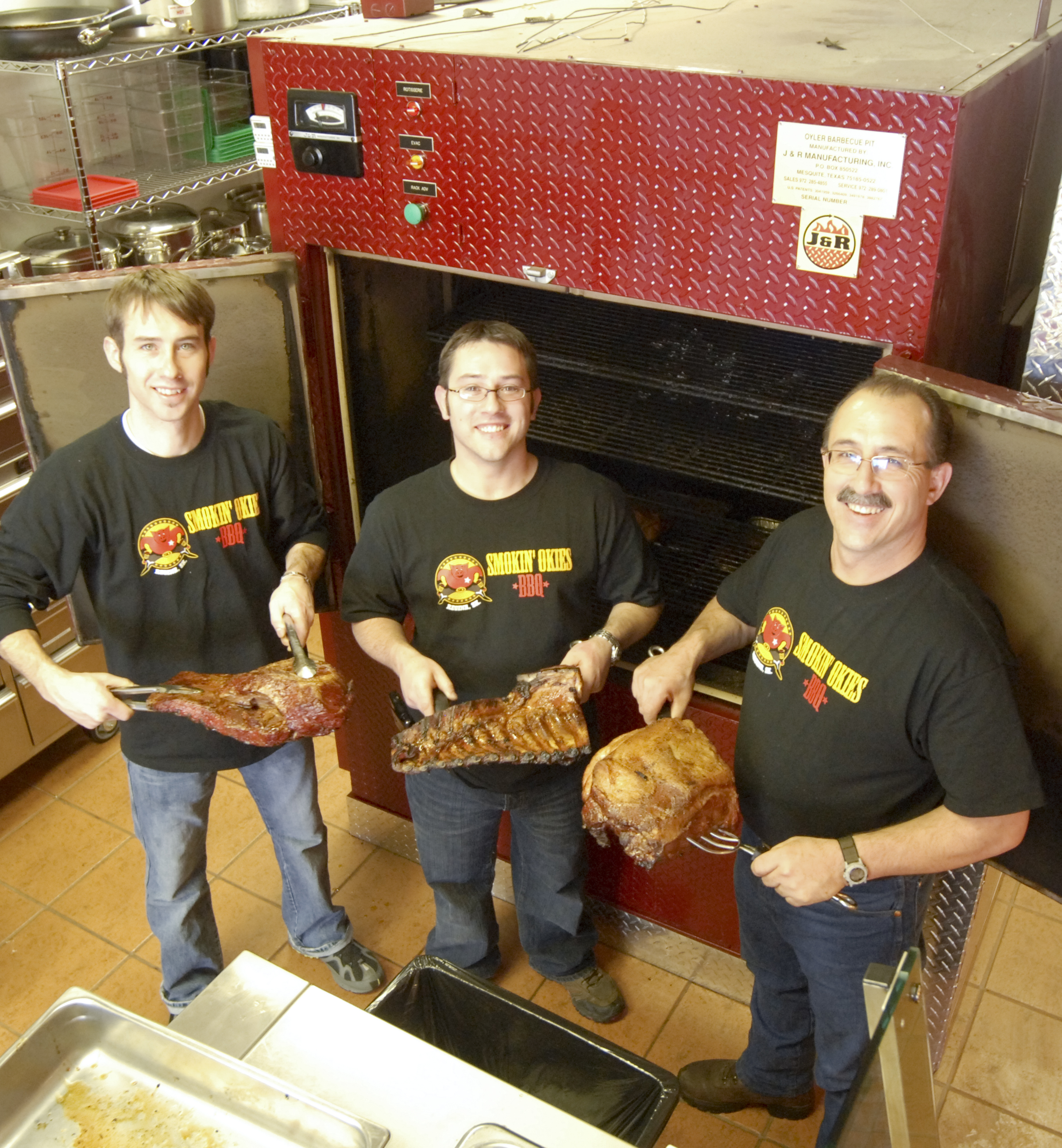 three guys with meat