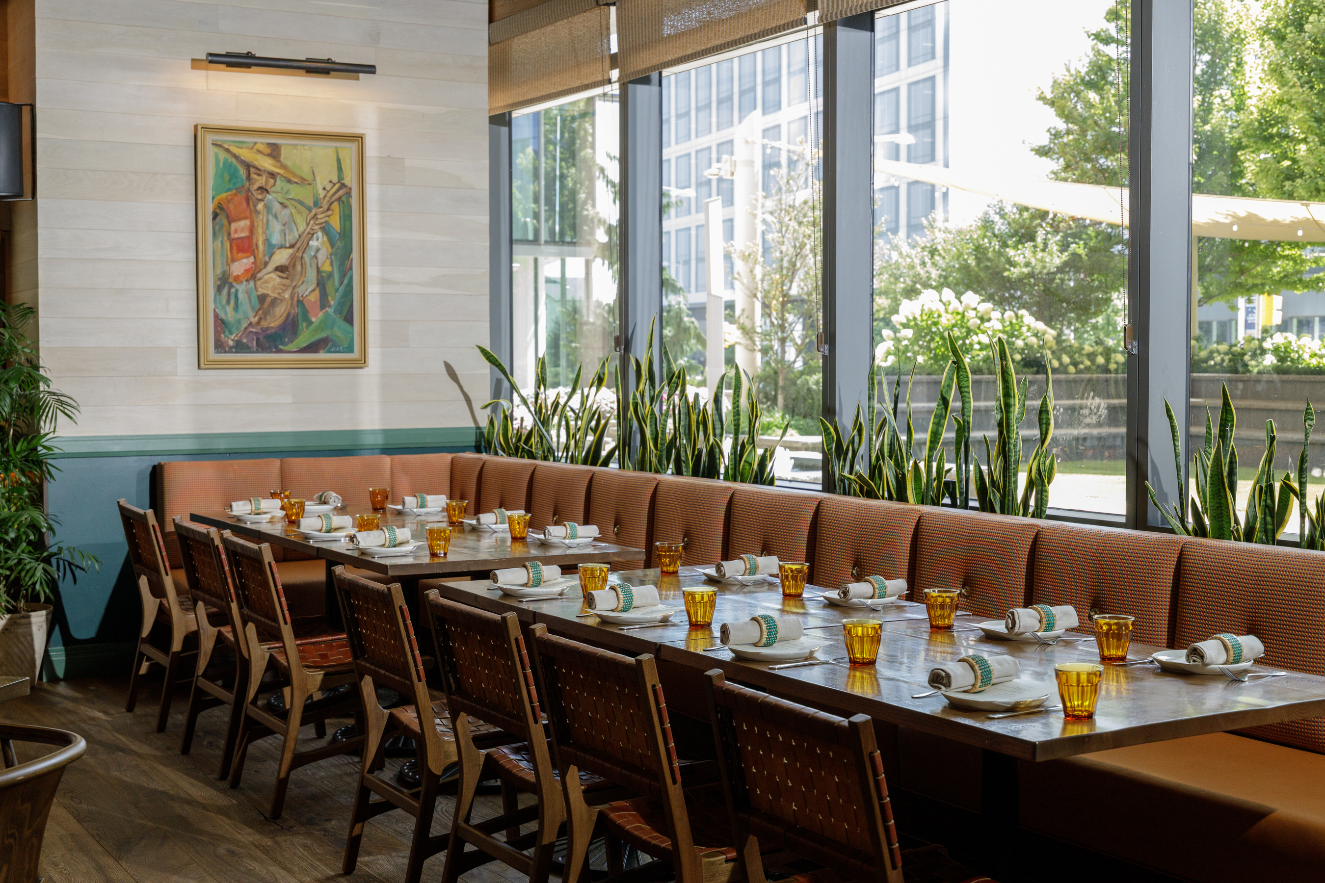 a dining room table in front of a window