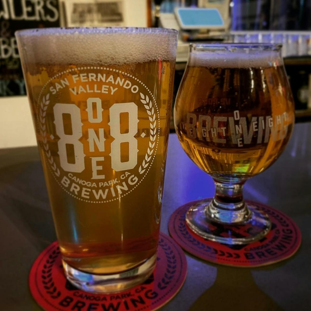 a close up of a glass of beer on a table