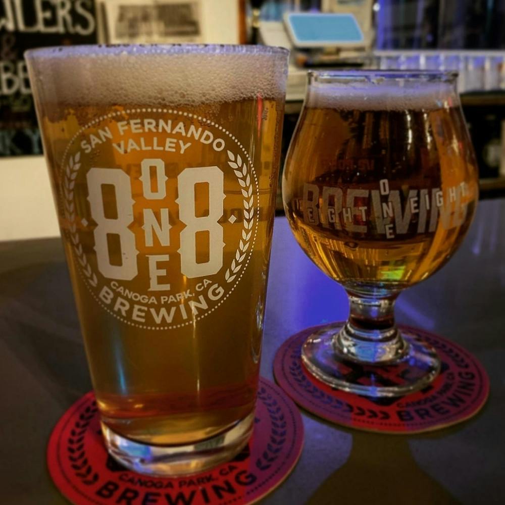 a close up of a glass of beer on a table
