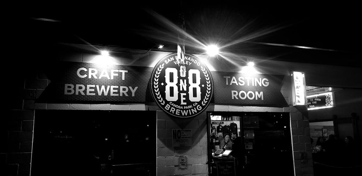 a sign above a store at night