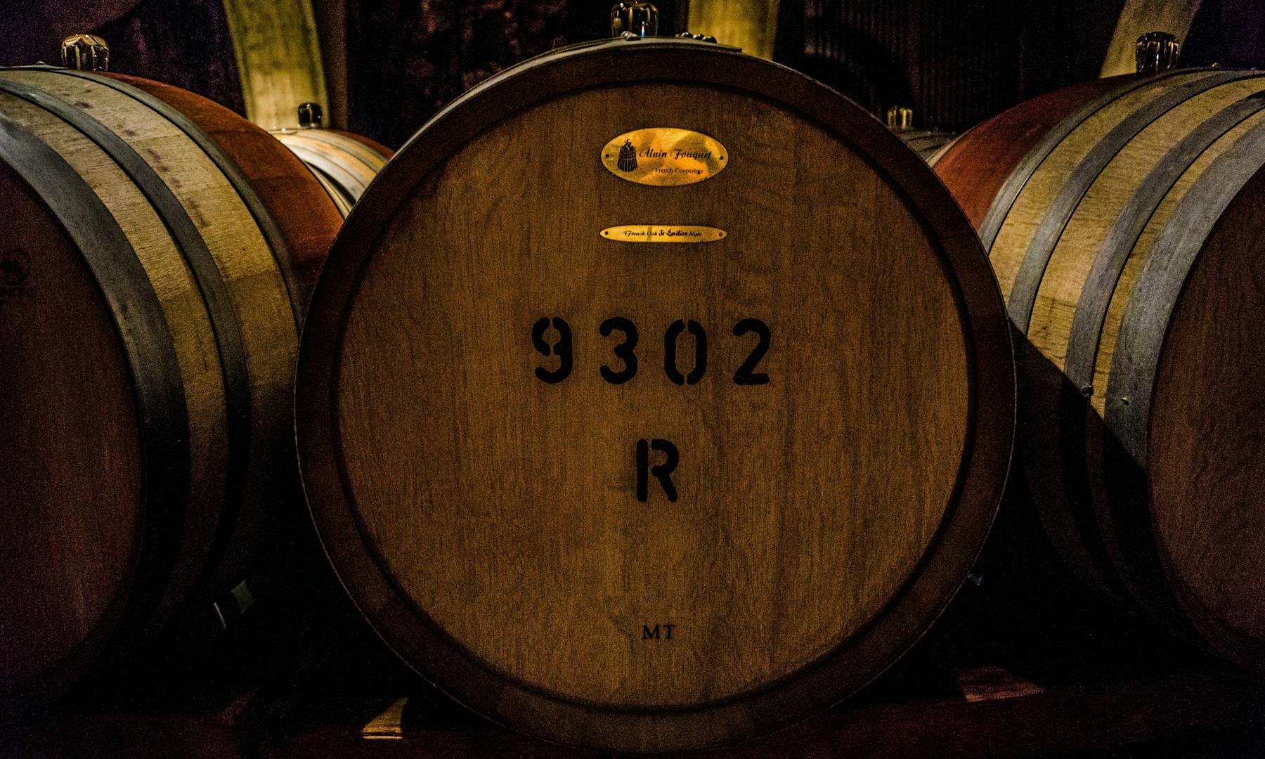 a train sitting on the side of a barrel