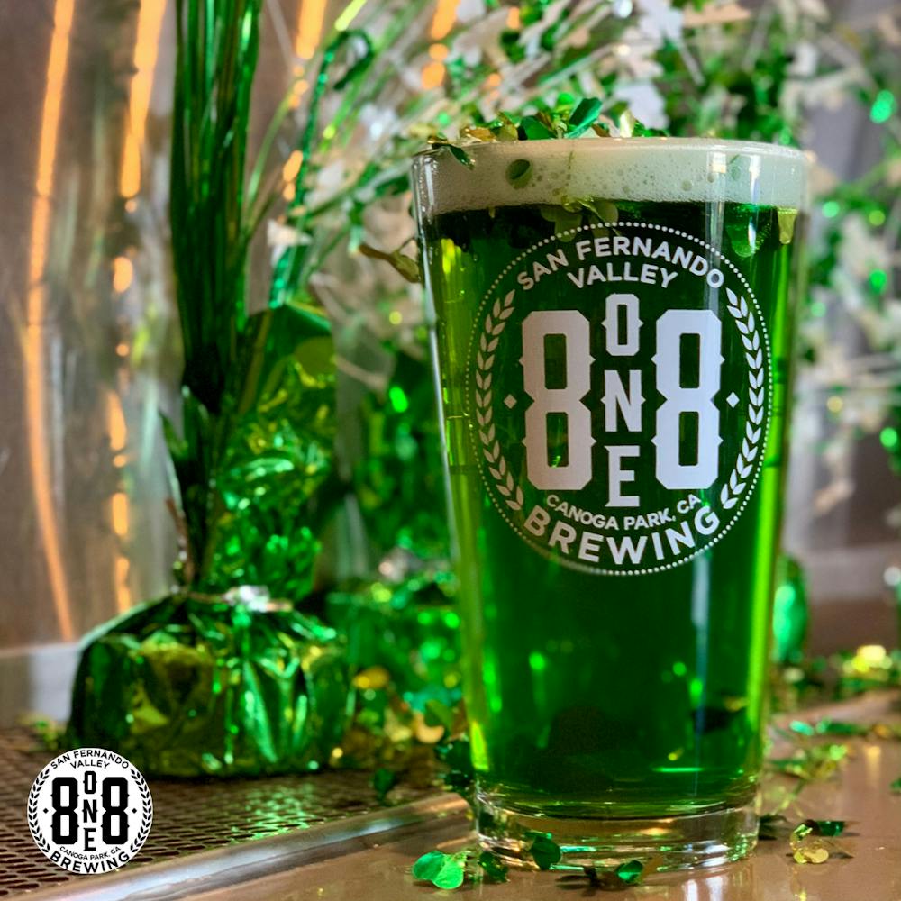 a bottle and a glass of beer on a table