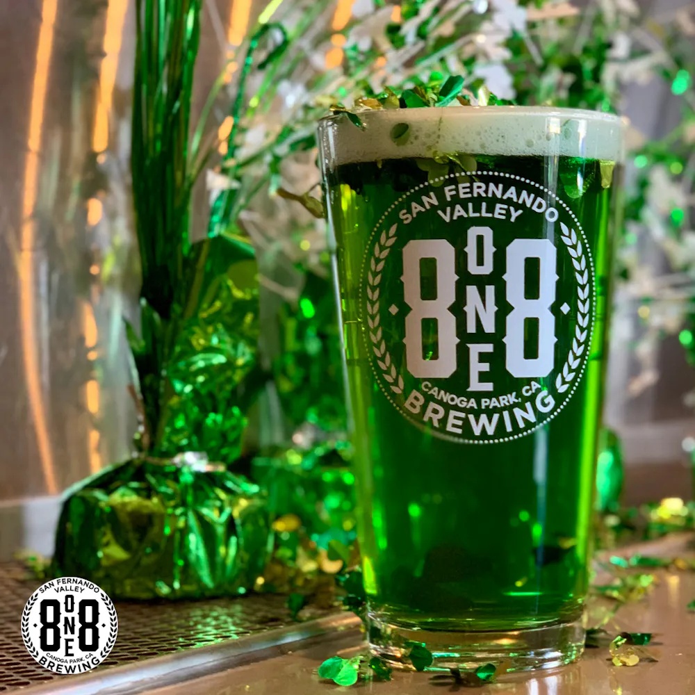 a bottle and a glass of beer on a table