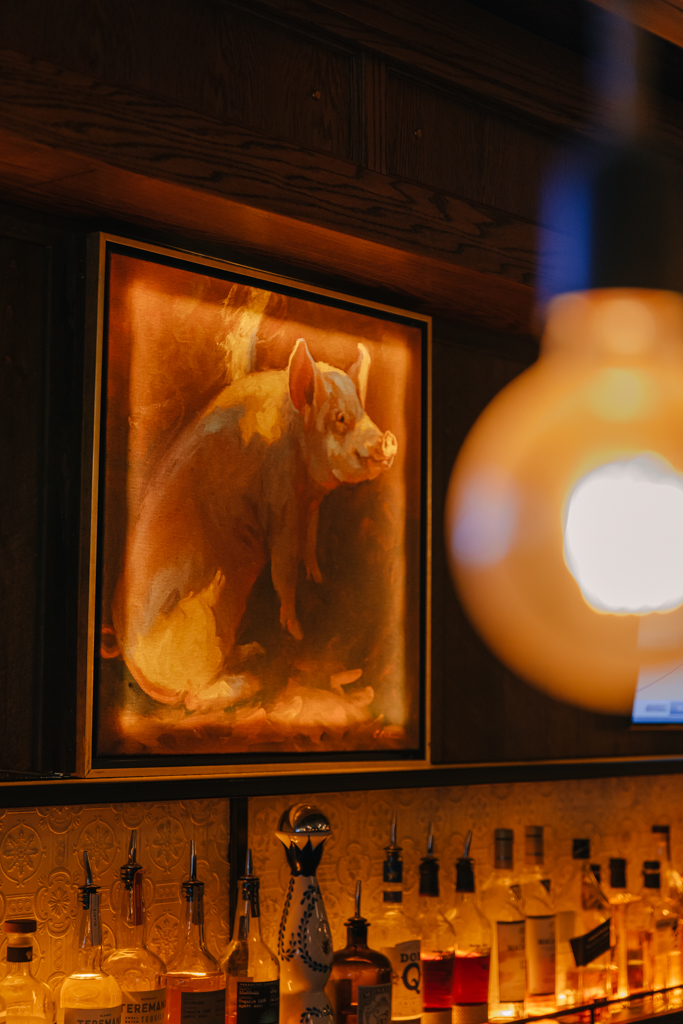 a fireplace in front of a mirror