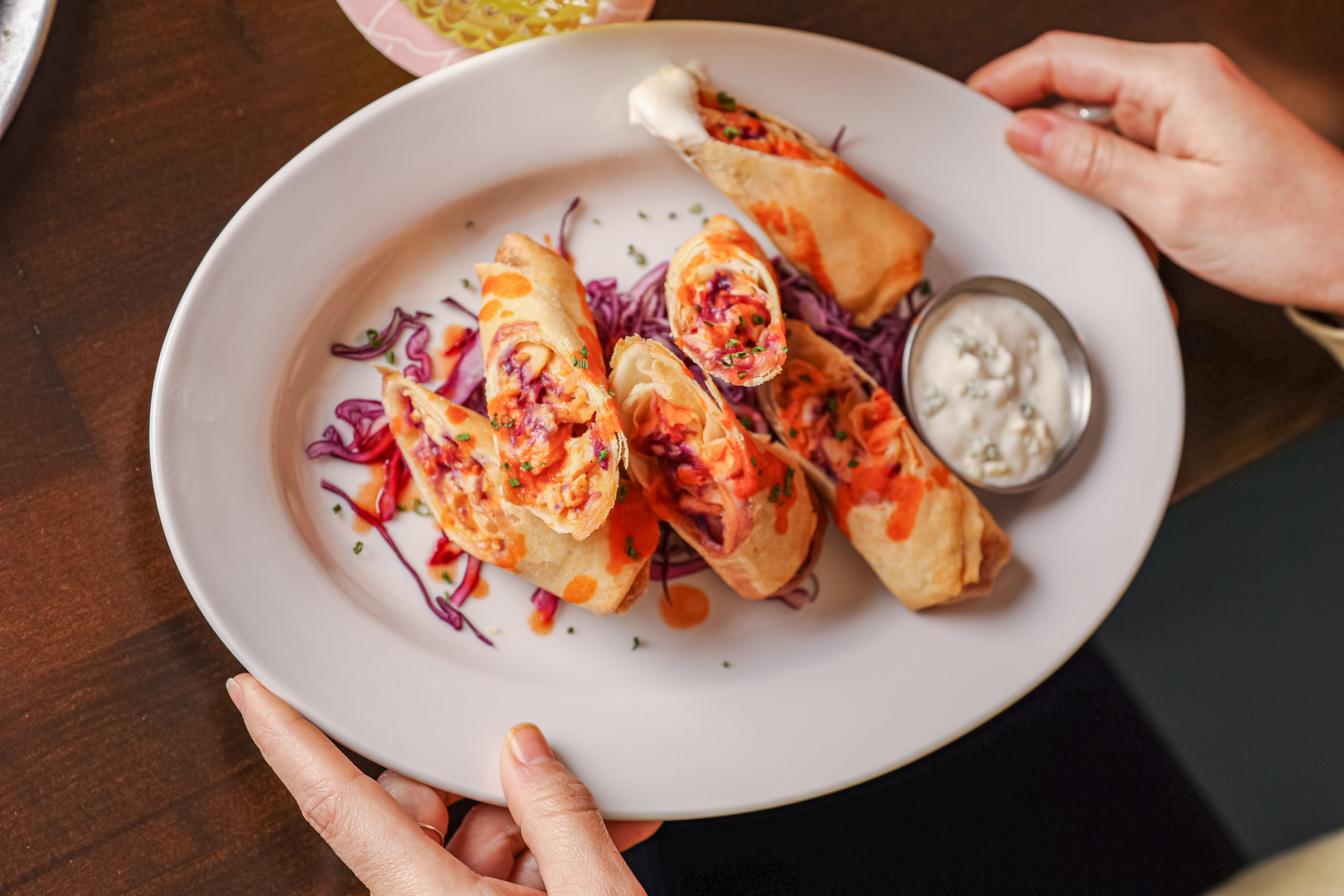 Buffalo Chicken Spring Rolls with a side of blue cheese
